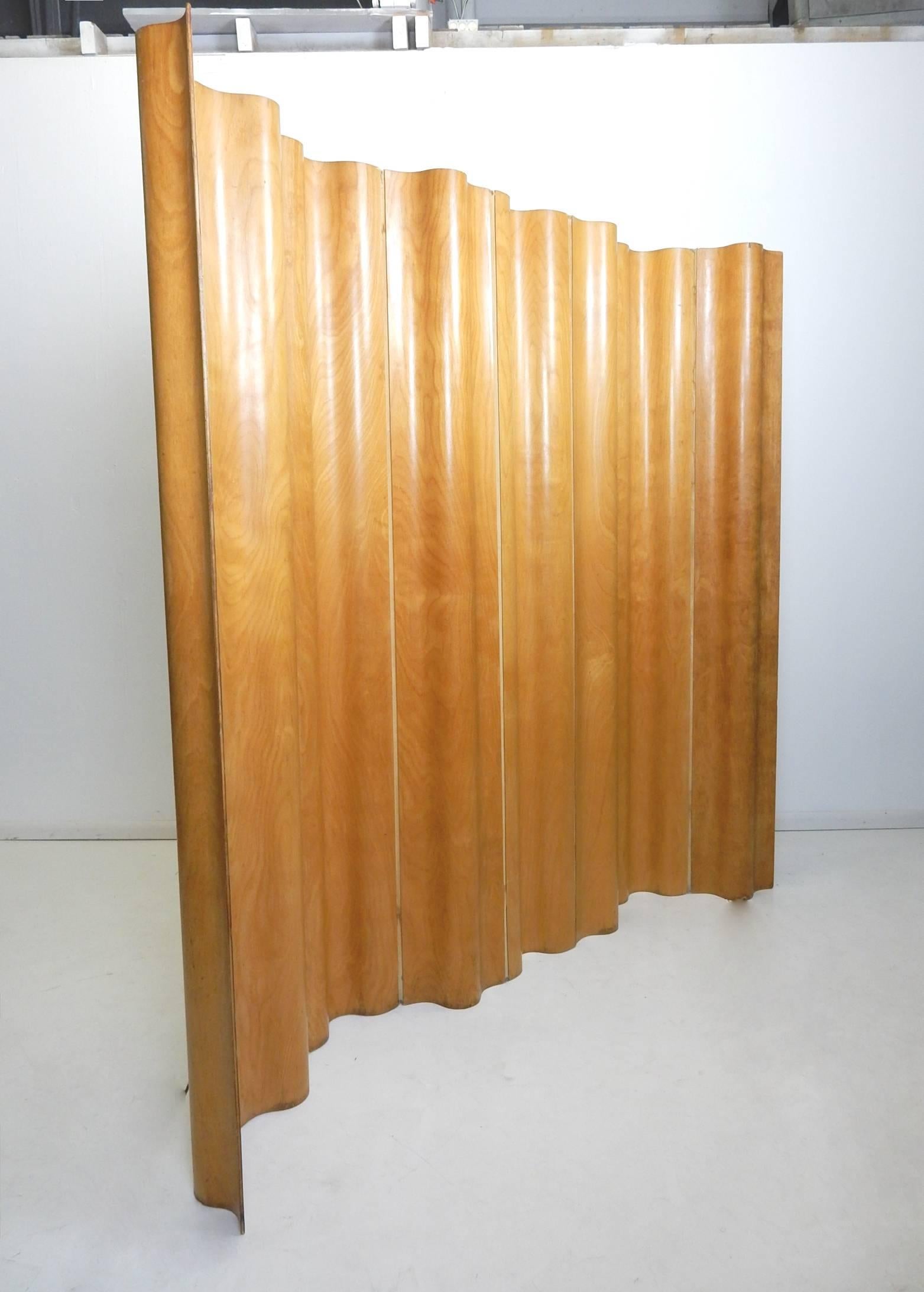 Rare, early original tall molded birch plywood folding room divider screen designed by Charles and Ray Eames.
Eight panels with woven canvas between. Perfect for creating privacy or layered space.
Shows some age however perfect for use as intended.