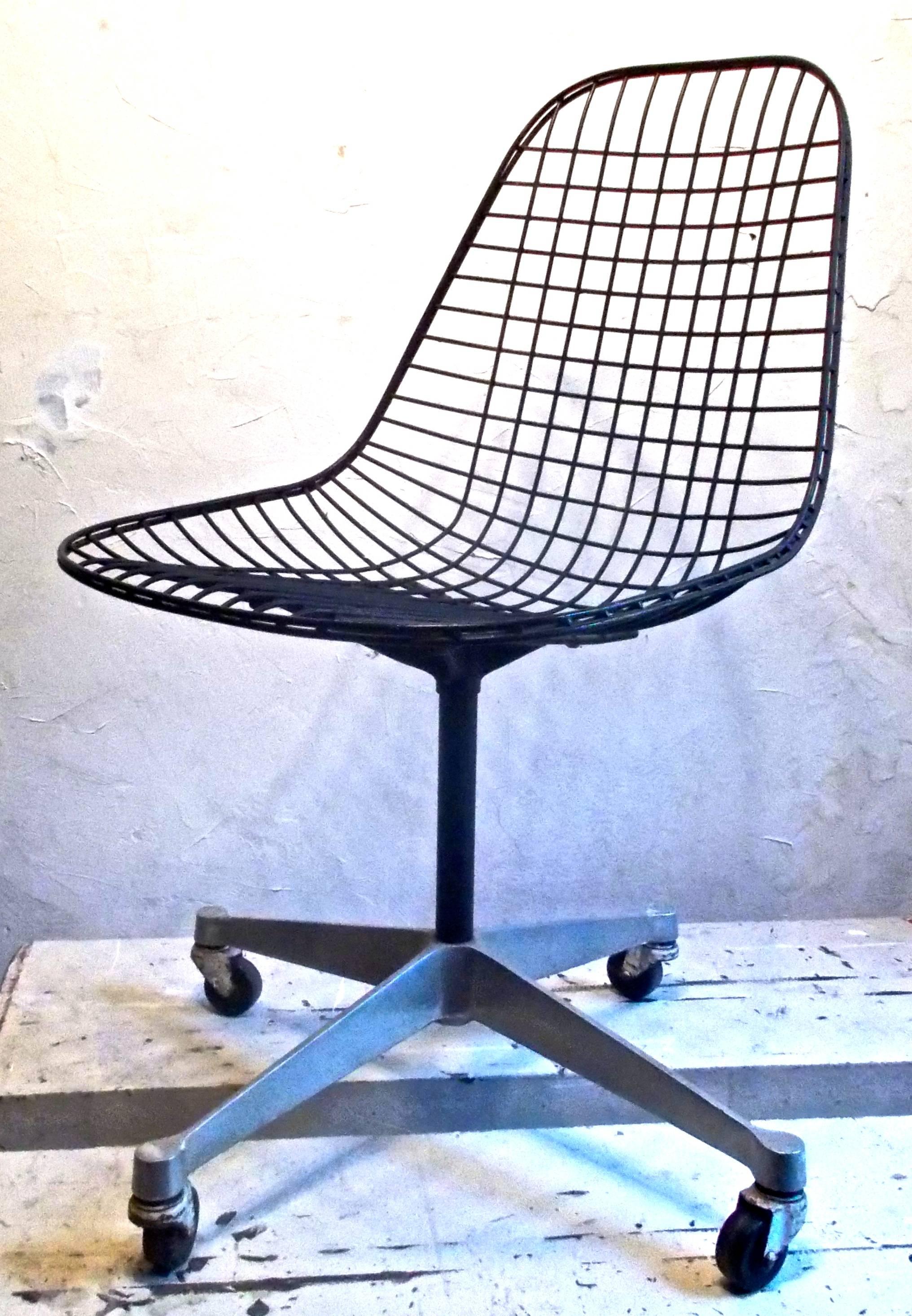 The Classic Eames black wire with a cast aluminium base with rollers.