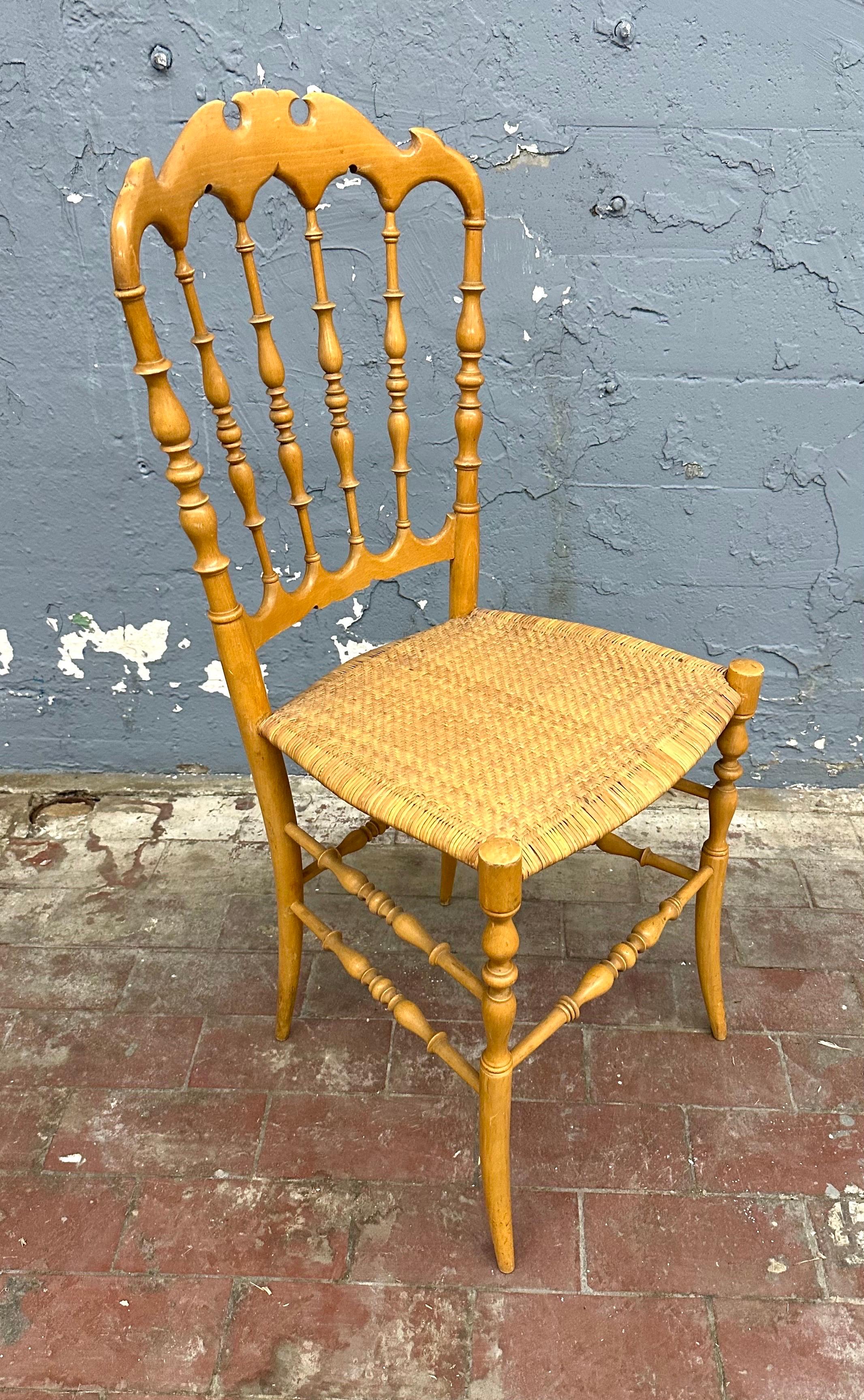 Carved fruitwood chair with beautiful, original cane seat. 
