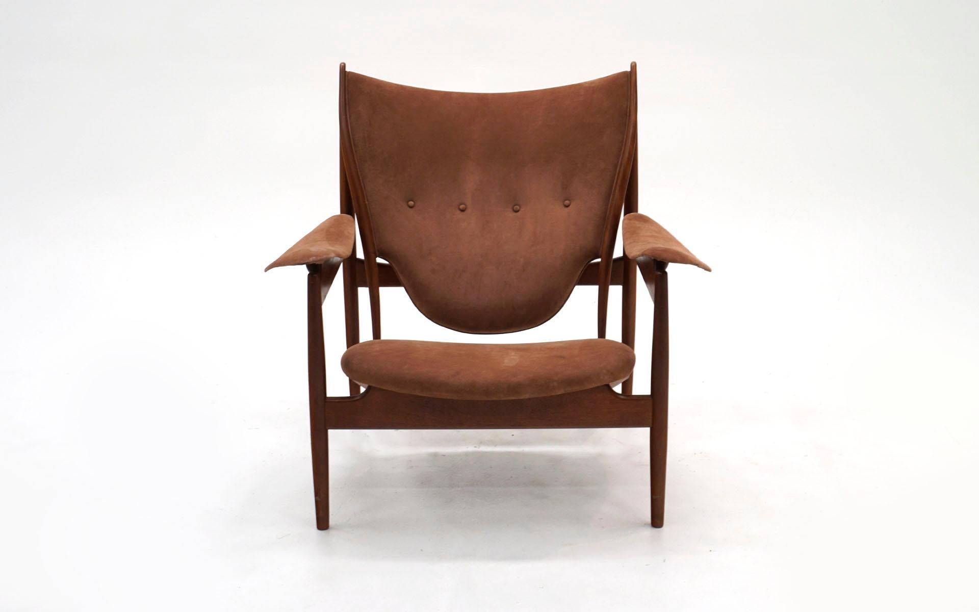 Rare, early, and most desirable Finn Juhl Chieftain lounge chair made by cabinet maker Niels Vodder. Solid teak frame with no evidence of repairs. Suede upholstery is likely not original but nicely done.

Branded manufacturer's mark to underside