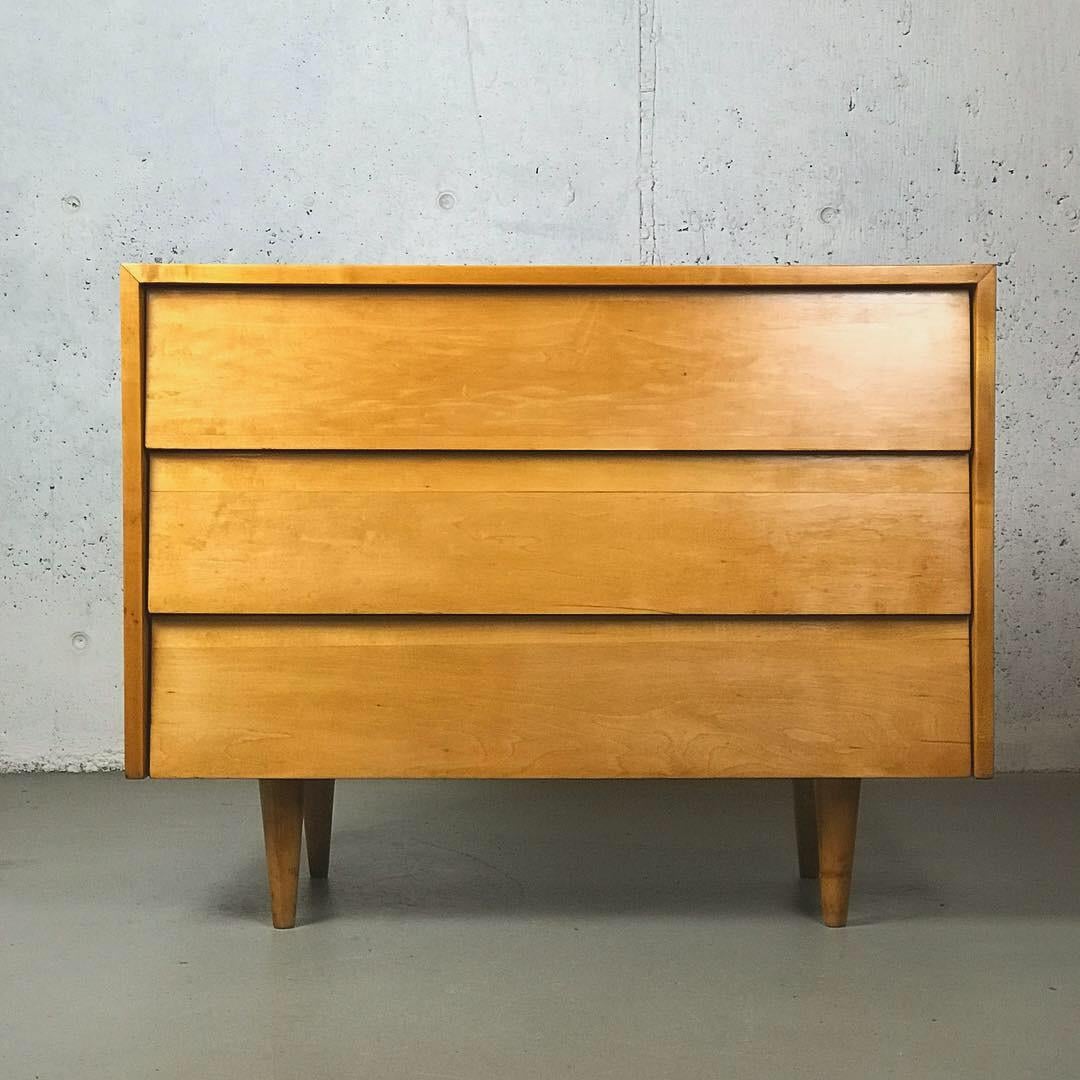 Three drawer chest designed by Florence Knoll for Knoll Associates in 1948. Produced from 1948-1956. Made of birchwood and measures 36” wide x 18” deep x 28” high. Early Knoll Associates label. Dresser has been refinished but shows minor wear under
