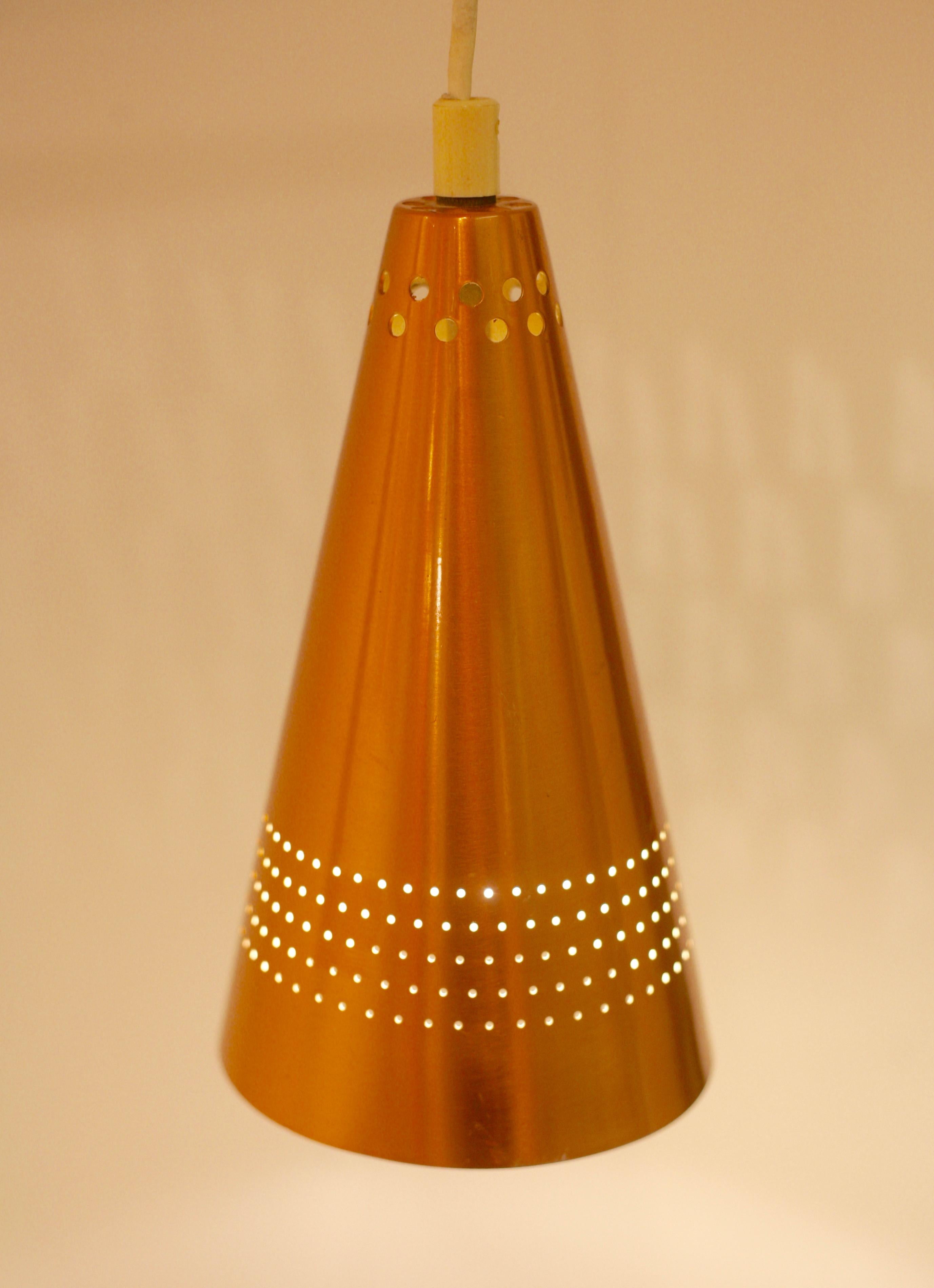 Extremely rare, early wall lamp designed by Hans-Agne Jakobsson and produced by his own company while still in Åhus, before the move to Markaryd, 1956. Model S-1718. Copper and teak. Measurements for total lamp. Lamp cone measures 21x12 cm.