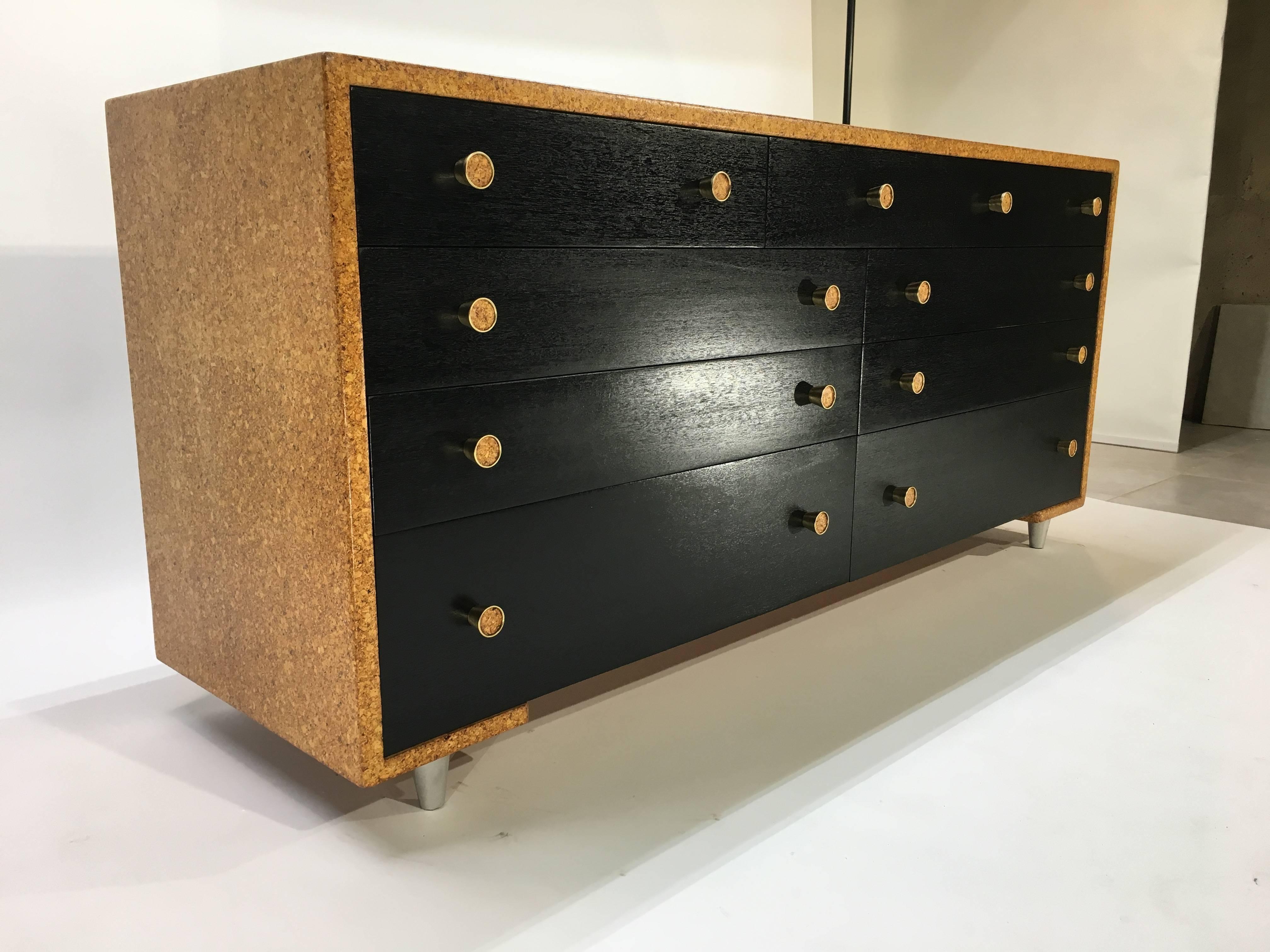 A rare early cork wrapped dresser designed by Paul Frankl for Johnson Furniture Company, circa 1947. Original labels inside top drawer. Masterfully refinished and in excellent condition.
 