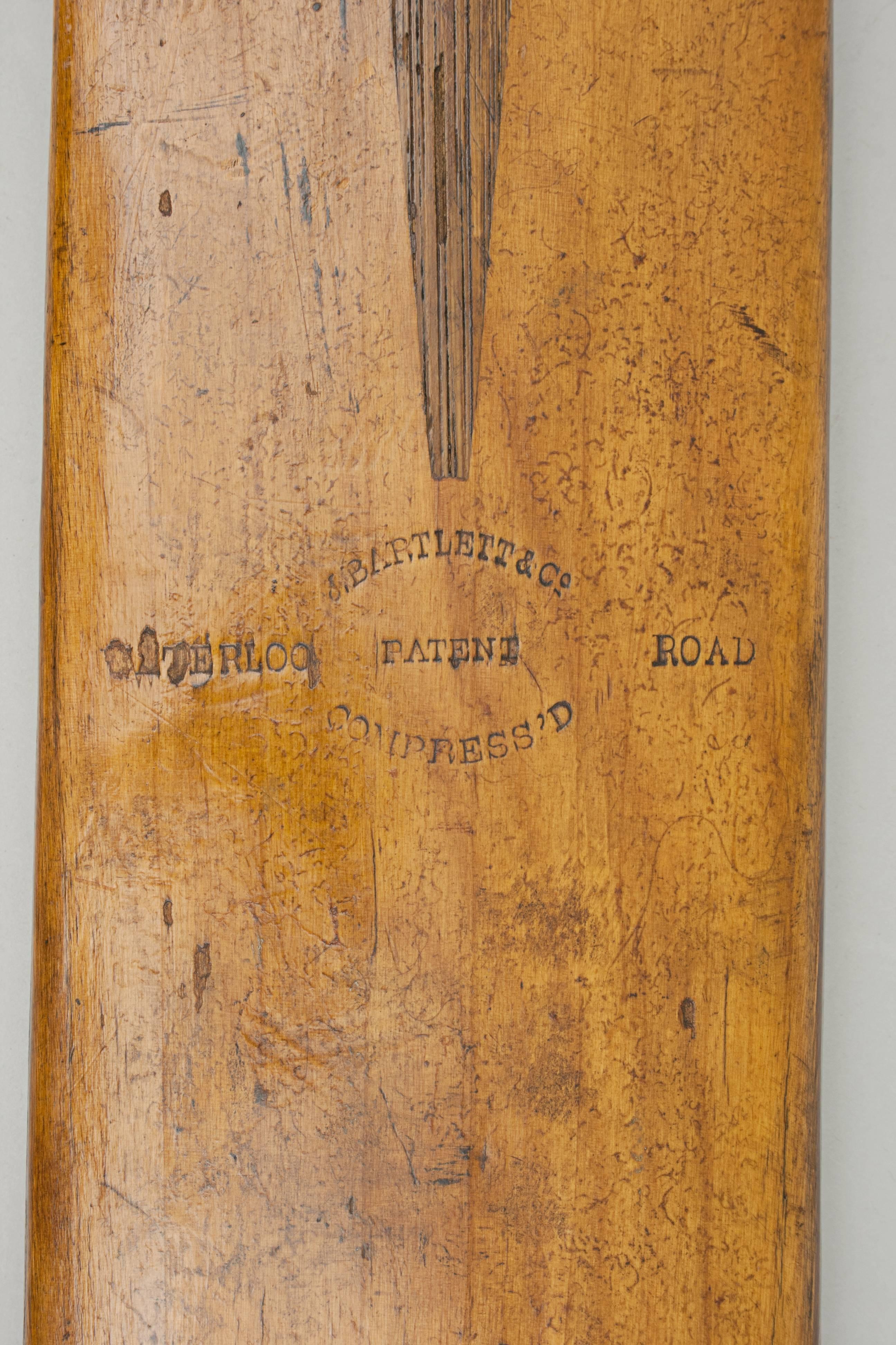 Victorian J. Bartlett & Co. Cricket Bat.
A good early willow cricket bat made by J. Bartlett & Co., Waterloo Road, London. The bat has a rounded back, cord strung handle, round shoulders and very attractive patination. The blade stamped 'J.Bartlett