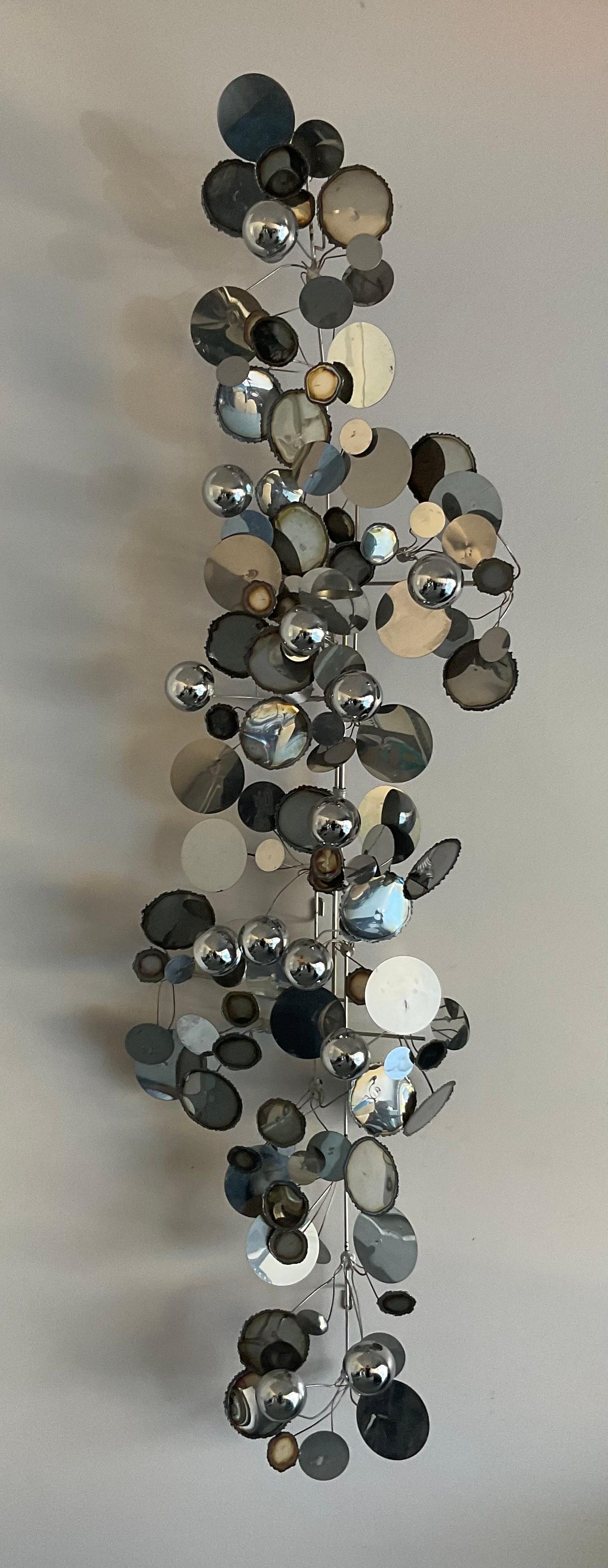 Curtis Jere Early Chrome Raindrops Sculpture Signed by the Artist circa 1970’s. This sculpture has beautiful patina and vibrant color and can can hang both vertically or horizontally depending on your interior needs. 