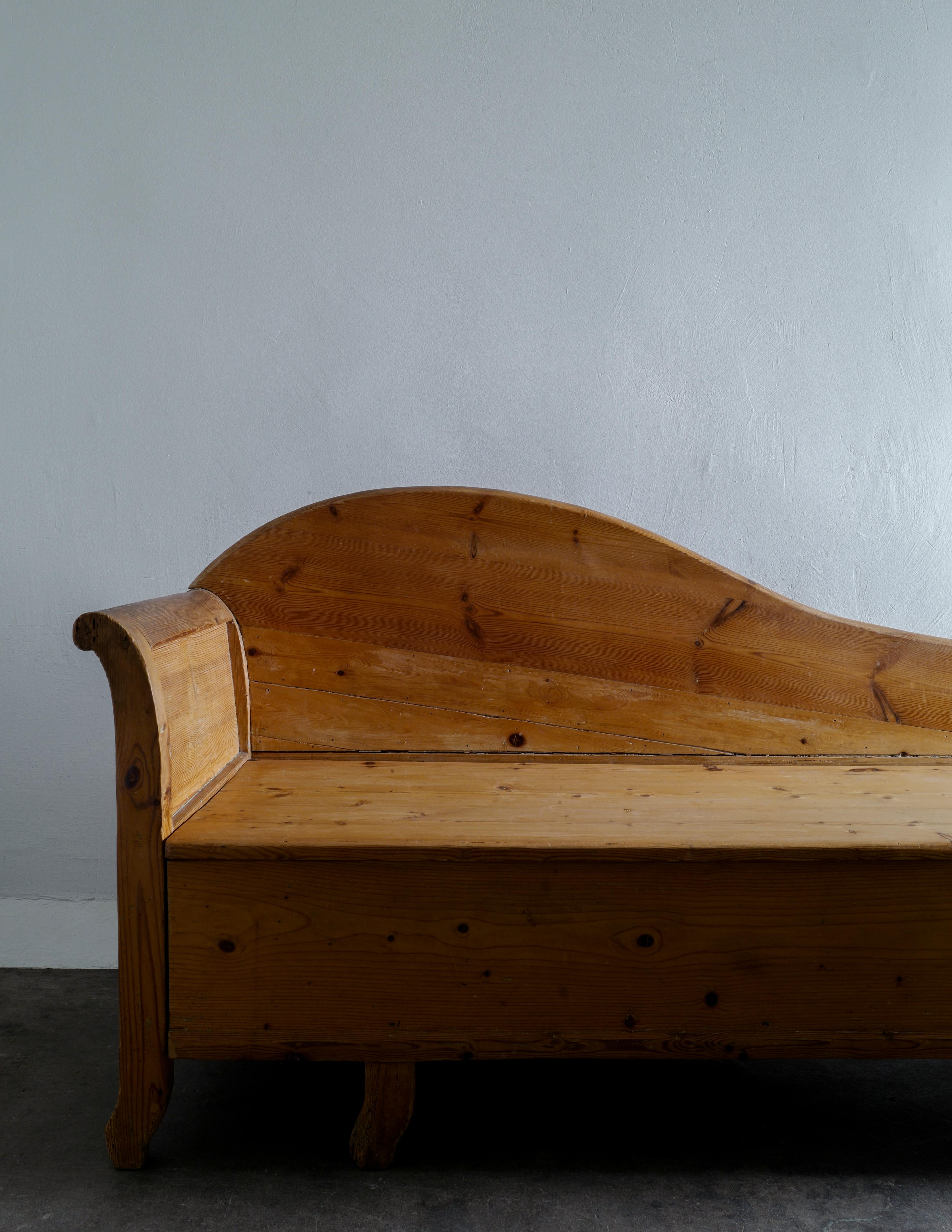 Scandinavian Modern Early Curved Sofa / Canapé in Solid Stained Pine Produced in Sweden, 1920s 
