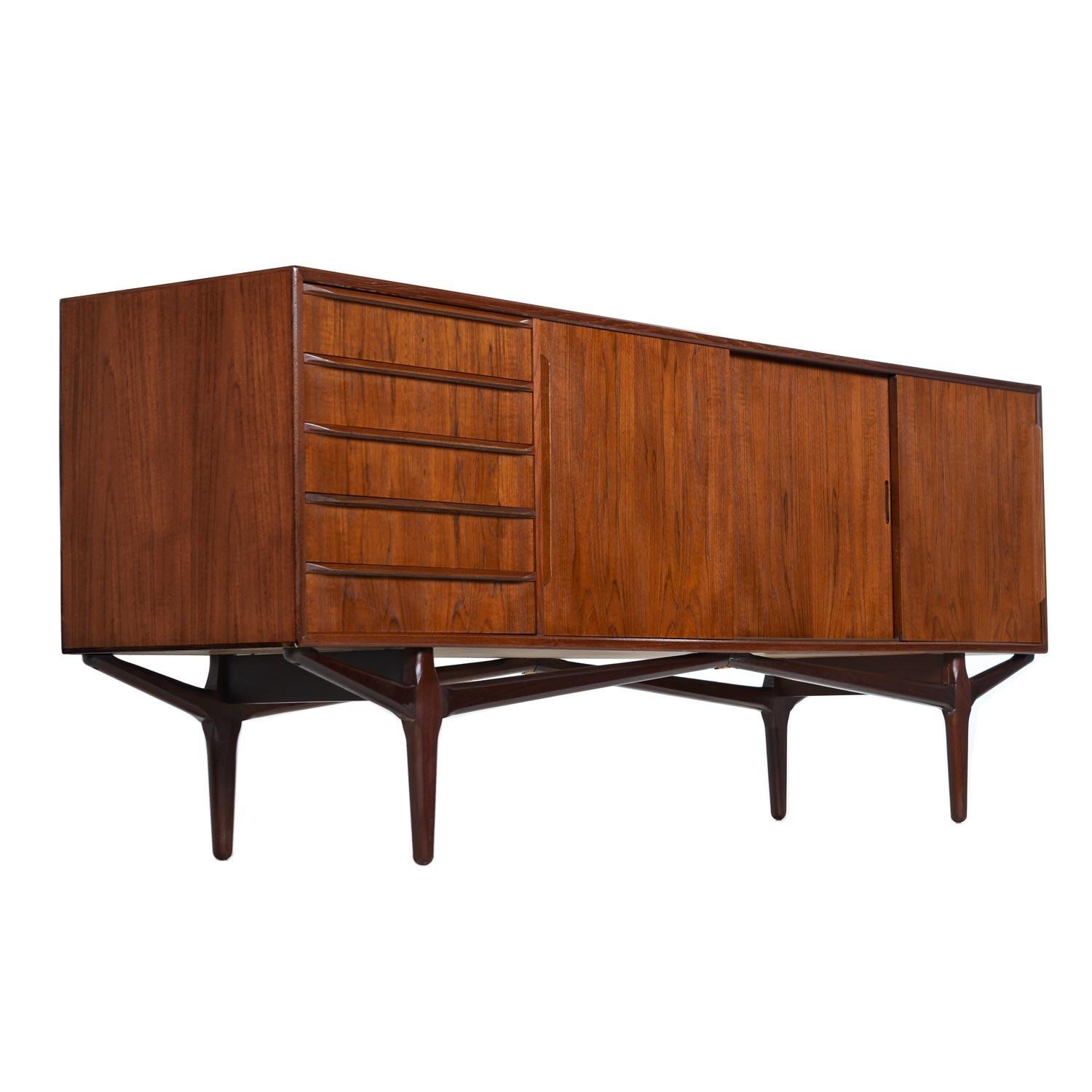 This is one of the most elegant Danish teak credenzas that we’ve had the pleasure to present. The deep, roasted cinnamon tone in the teak wood indicates and early vintage (late 1950s-early 1960s). A patina of such richness can only be garnered by