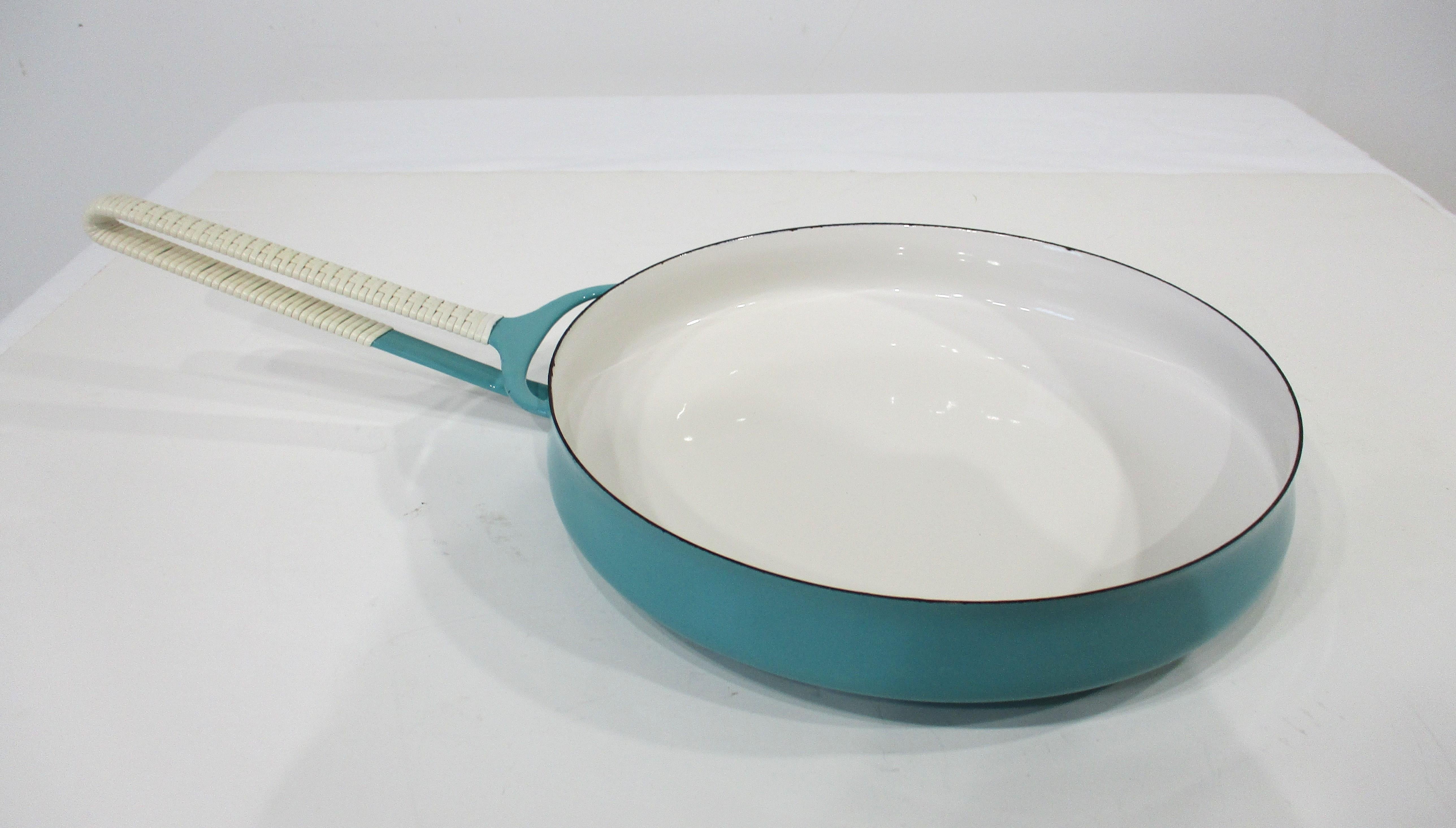 A very early production Koben style sauté pan in a sky blue turquoise tone with wrapped handle . The finely woven wrap to the handle and the enameled steel pan brought the Danish life style of artistic craftsmanship to America with their simple well