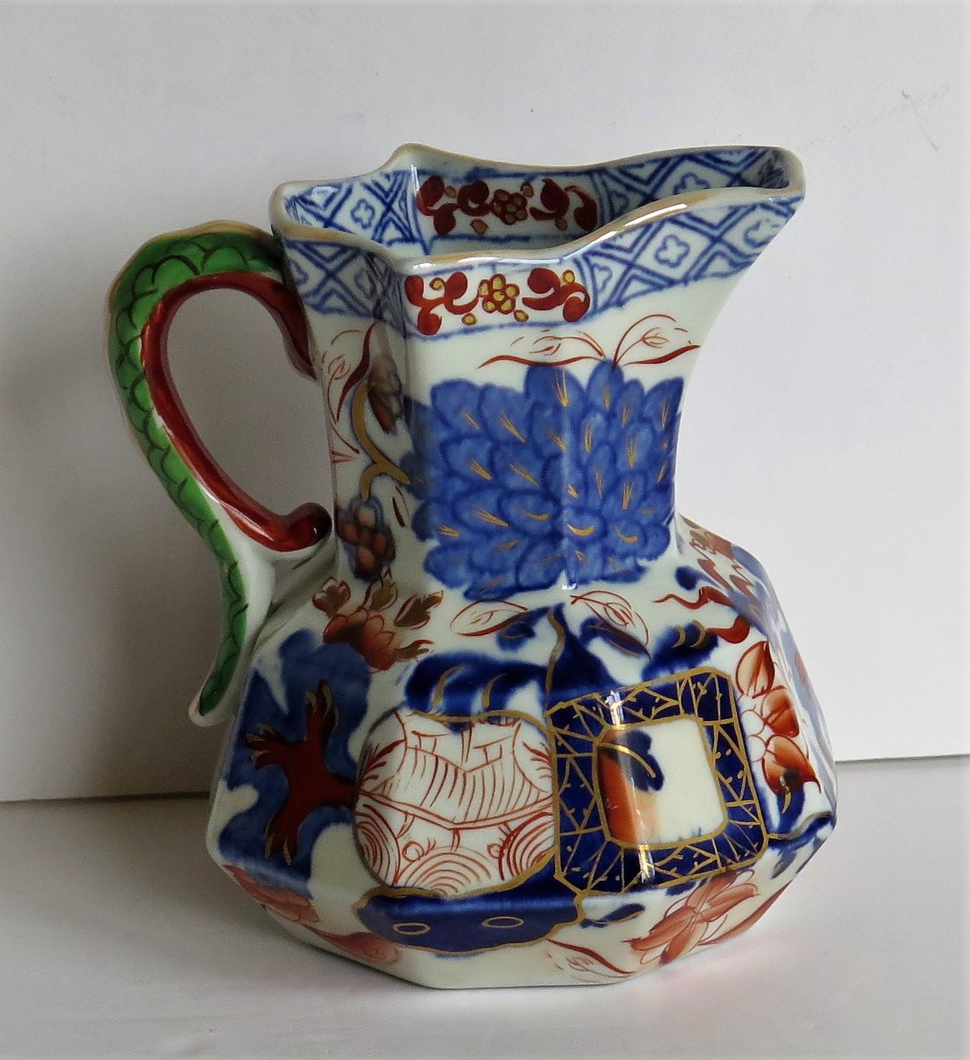This is a good Hydra jug or pitcher made by the Davenport Company of Longport, Staffordshire, England in the late Georgian period, circa 1805-1820, made of Ironstone pottery, which Davenport called Stone China.

It is hand decorated in a bold