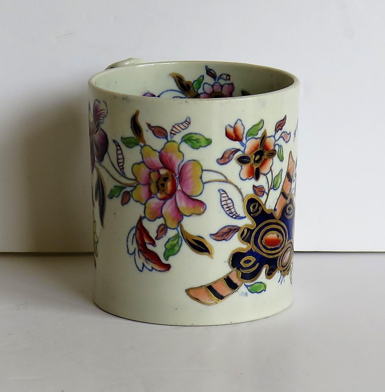 This is a rare and early stone China (Ironstone) mug which dates to the George 111 period, circa 1815 made by the Davenport factory of Longport, Staffordshire Potteries, England.

The mug is straight sided similar to a coffee can and has a loop