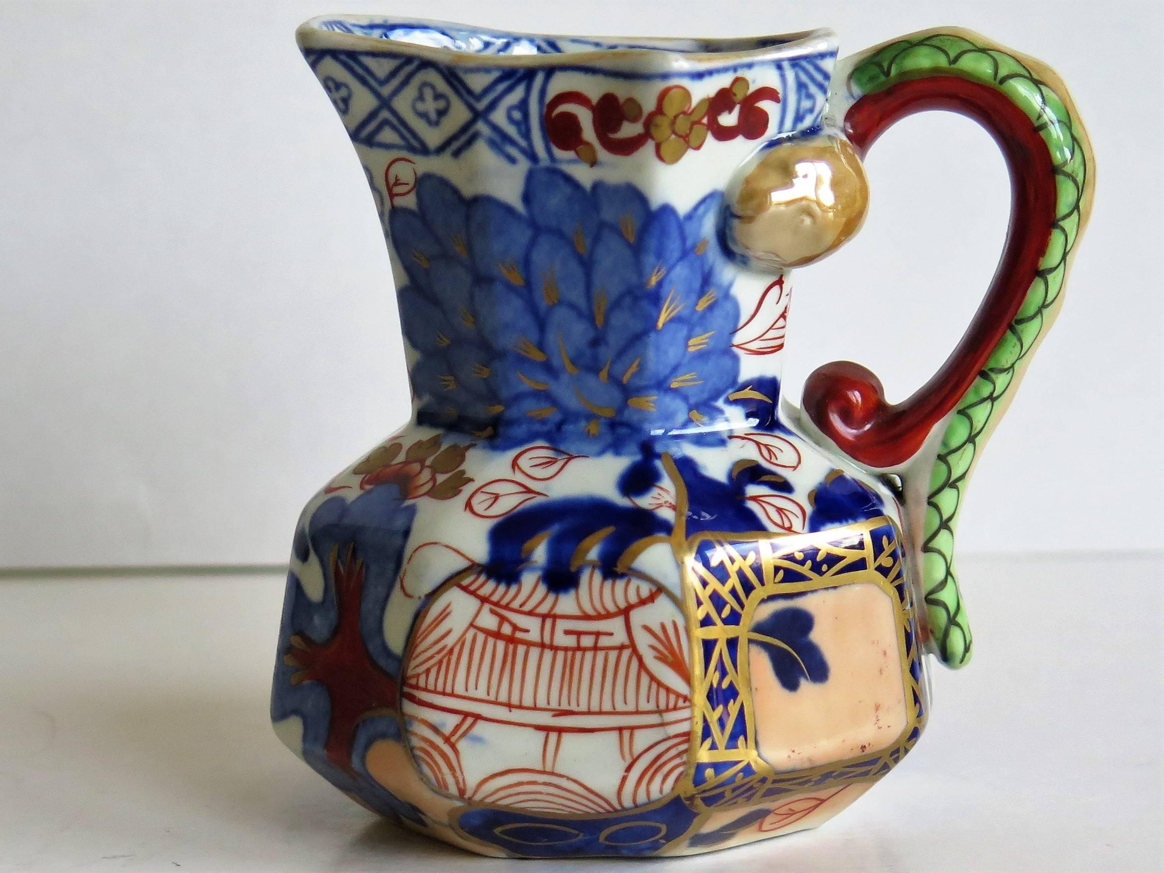 This is a good small Hydra jug, pitcher or cream jug made by the Davenport Company of Longport, Staffordshire, England in the late Georgian period, circa 1805-1820, made of Ironstone pottery, which Davenport called Stone China.

This is a very