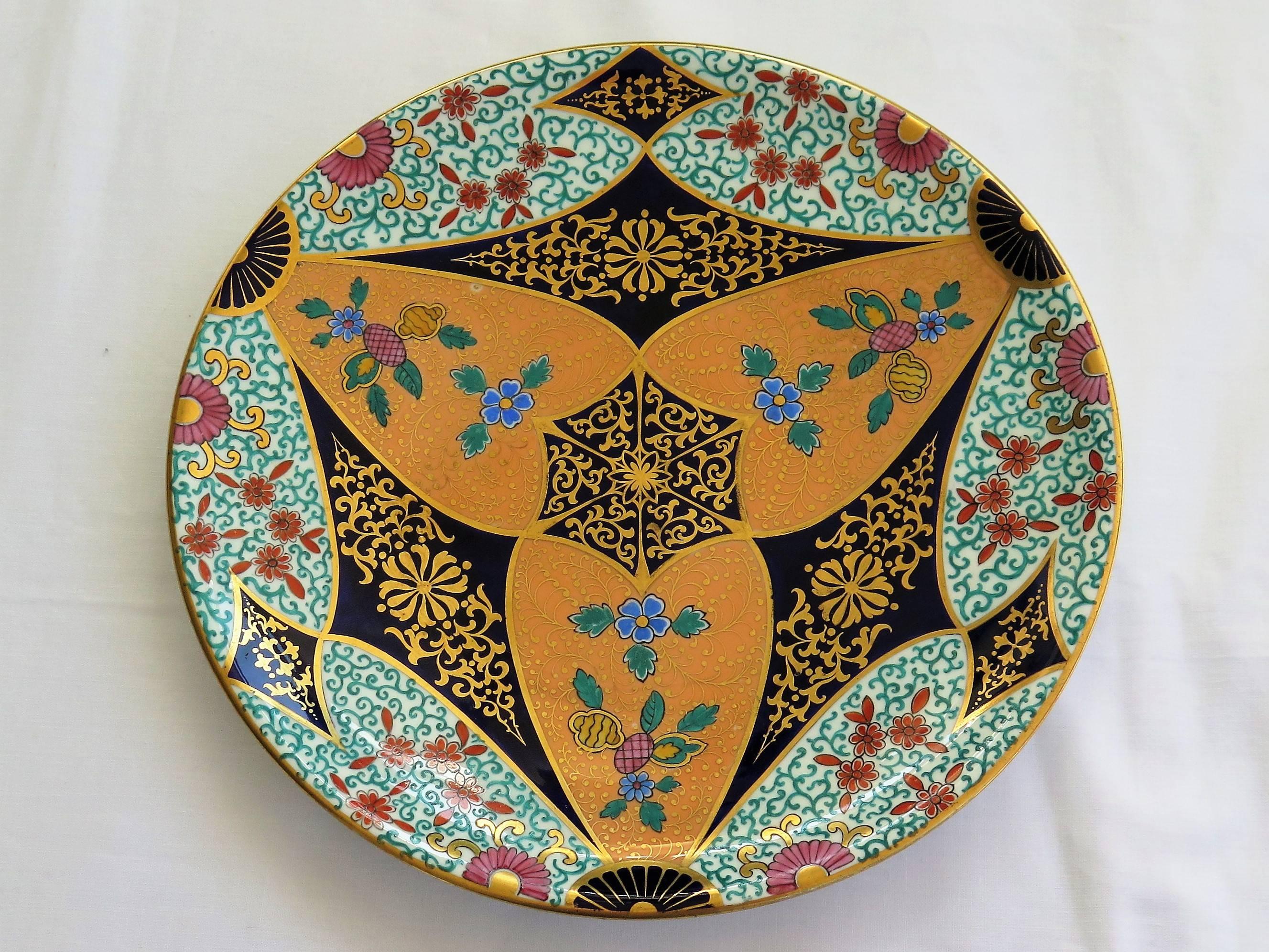 This is a beautiful early porcelain cabinet plate, all hand-painted, from the Davenport Company of Longport, Staffordshire Potteries, England, dating to very early in the 19th century, Georgian period, circa 1810.

The Plate has a striking oriental