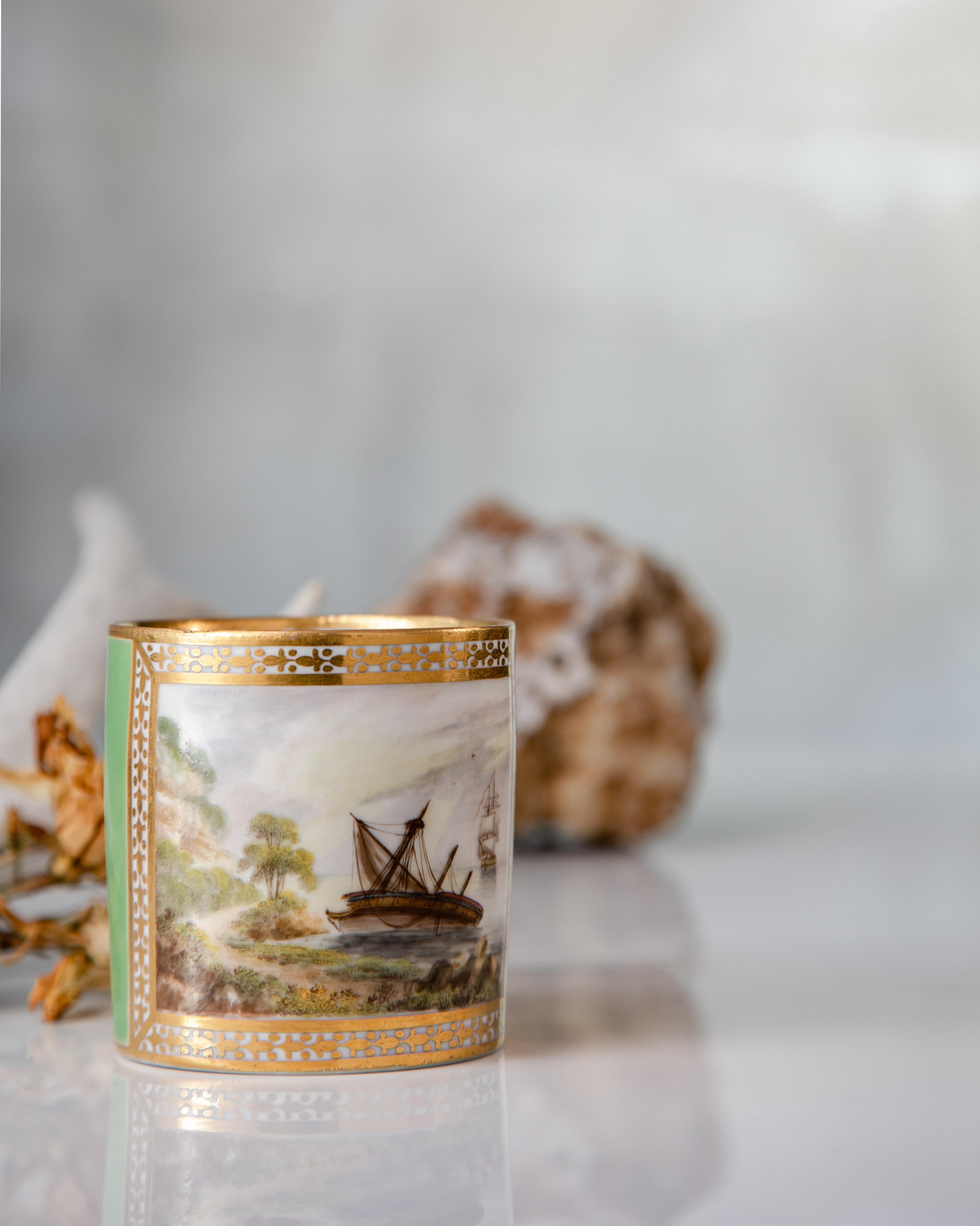 A green-ground porcelain coffee can made by the Derby Porcelain Factory circa 1795.

This green-ground coffee can is a fine example of early Derby porcelain. The shipwreck scene, titled on the bottom “A Shipwreck after a Storm” in hand-written