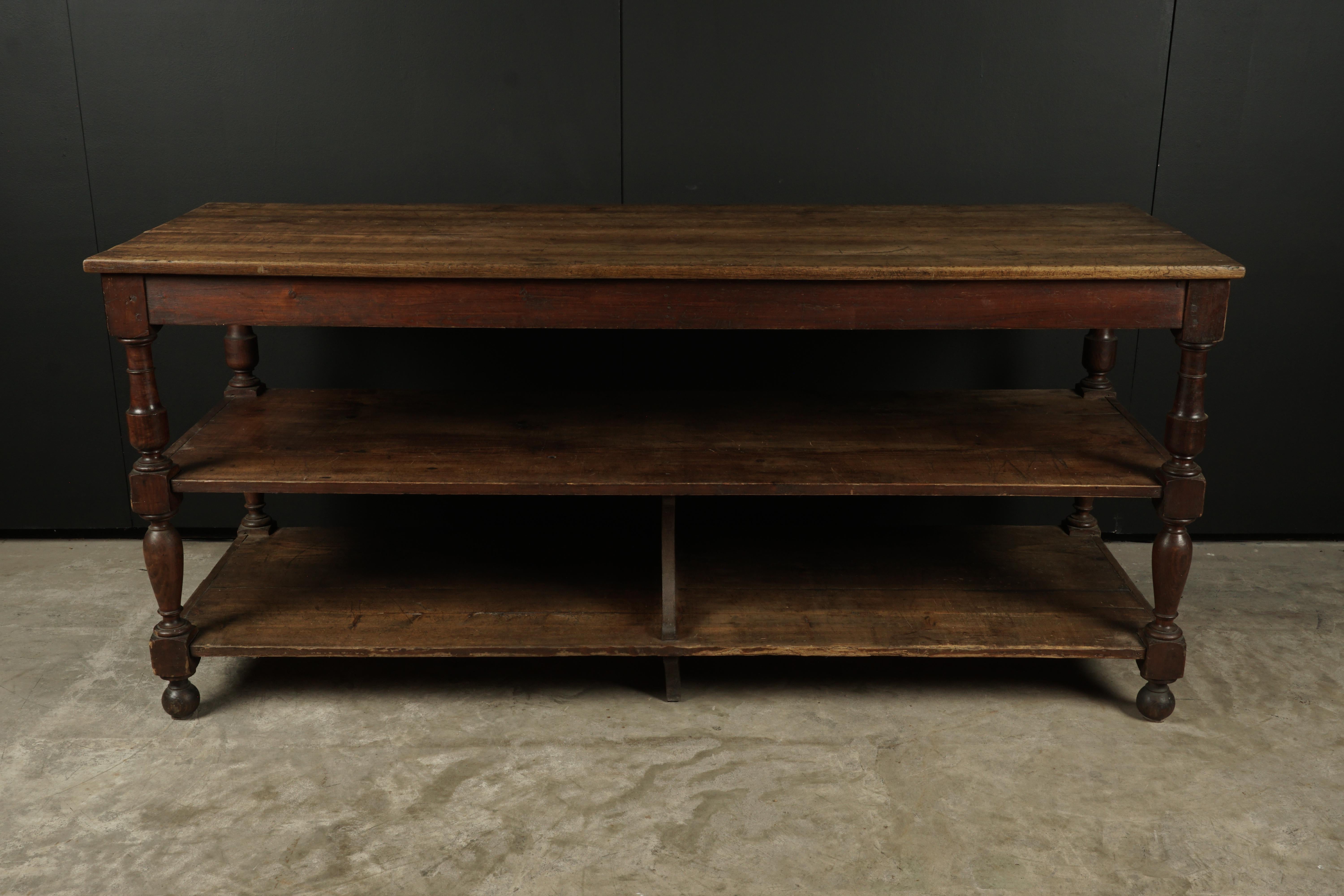 Early draper table from France, circa 1890. Solid pine construction with nice patina and wear. Presumably from a haberdashery.