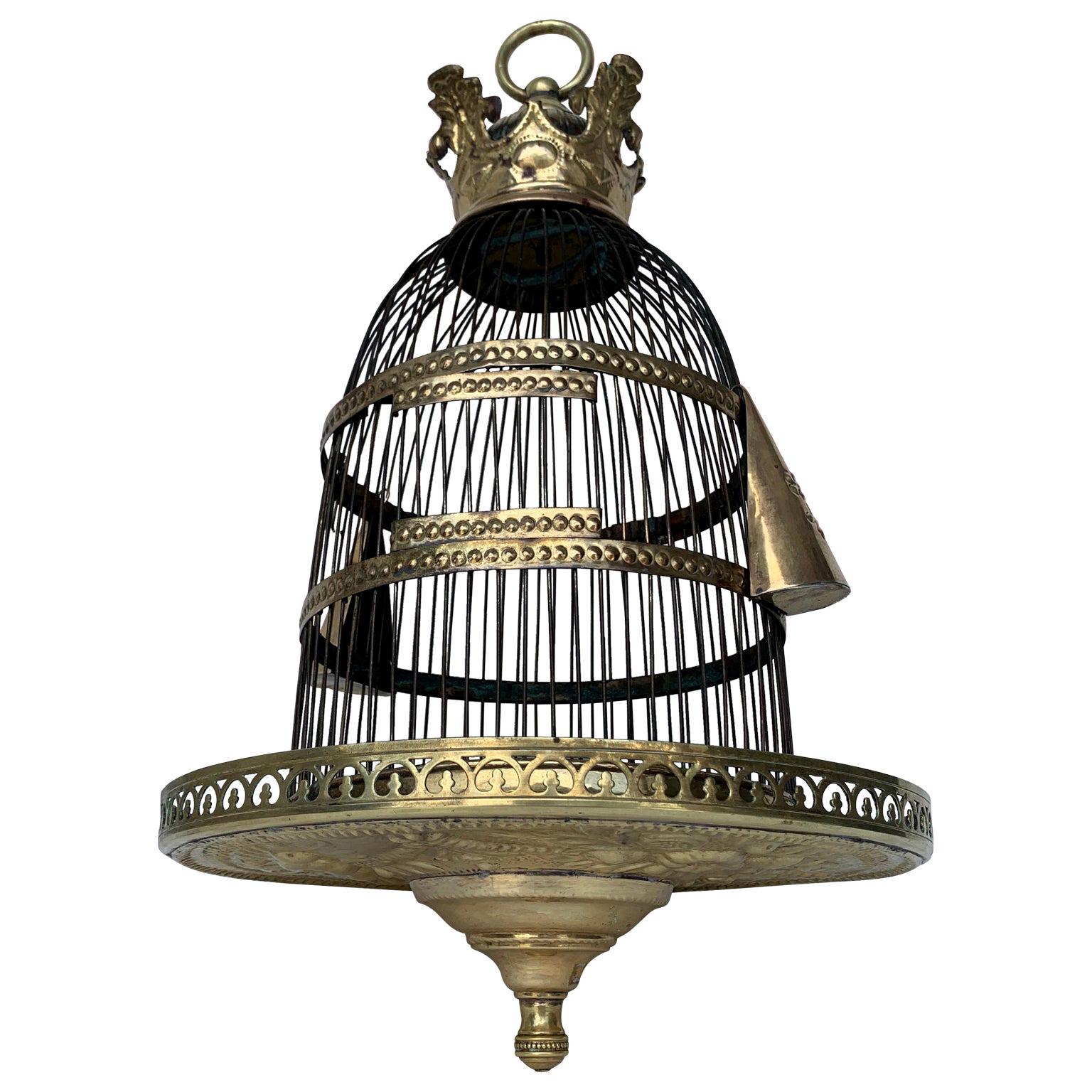 Early 19th century brass bird cage, circa 1810-1830

The bird cage has two bird seed containers that attaches to the cage.
  