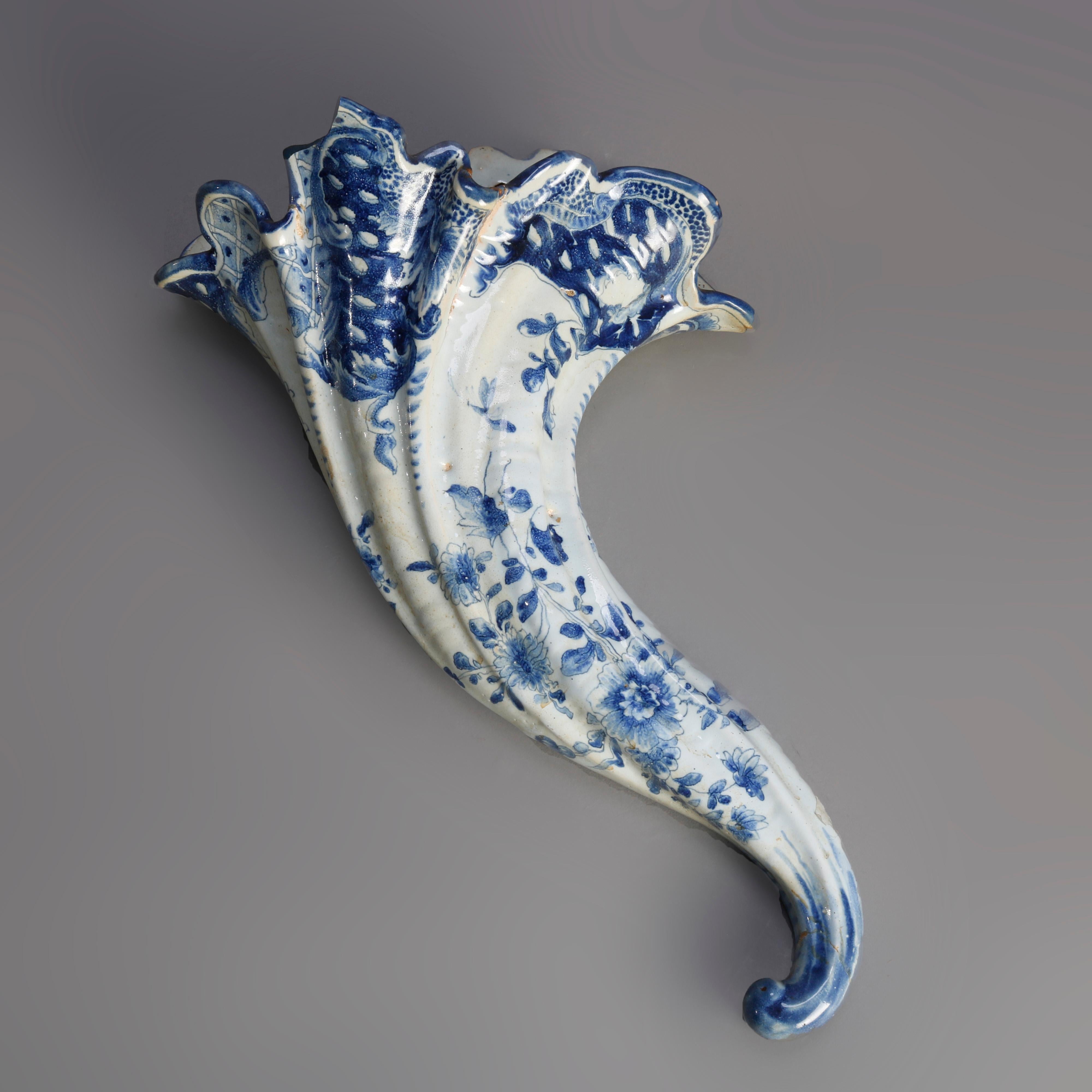 An antique pair of early Dutch delft pottery wall pockets offer cornucopia form with shaped top and blue decoration, en verso marked as photographed, 18th century

***DELIVERY NOTICE – Due to COVID-19 we are employing NO-CONTACT PRACTICES in the