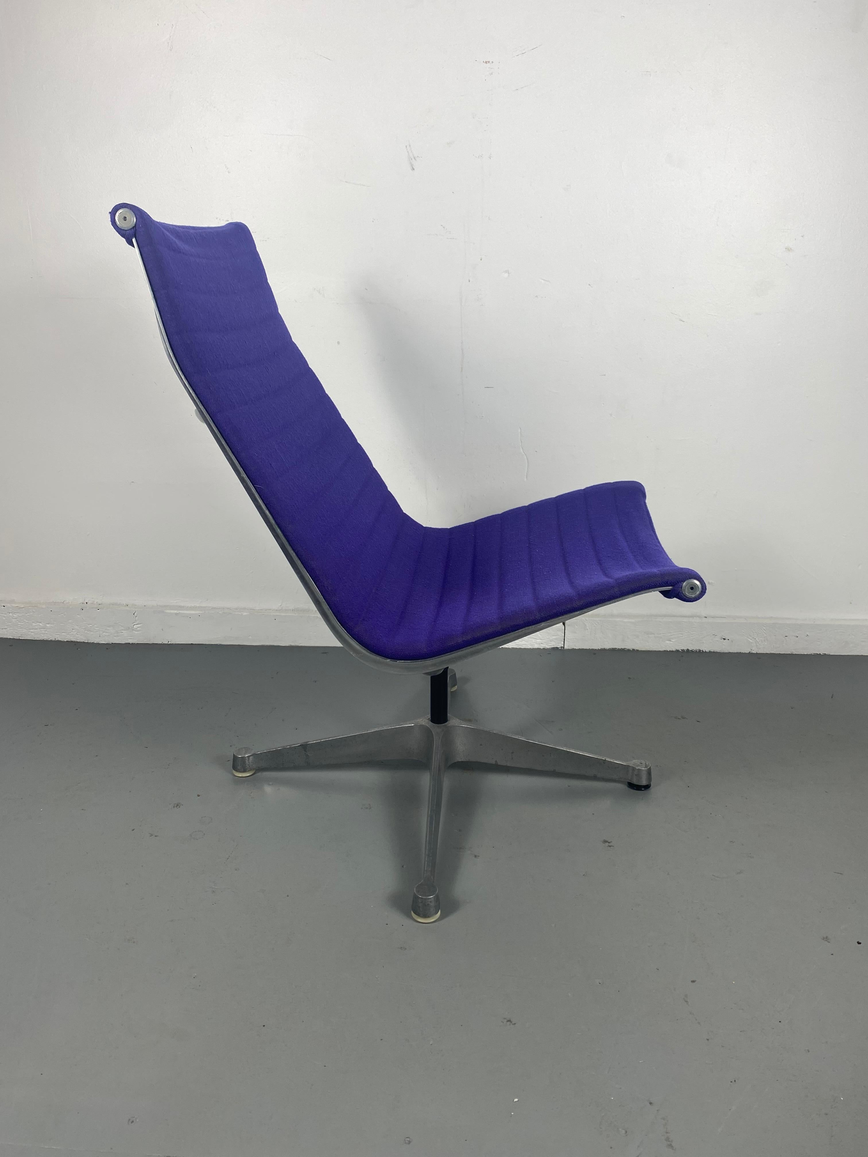 Early production charles & Ray Eames aluminum group lounge chair. Amazing purple wool fabric in great original condition, Signed with Herman Miller logo cast into frame.