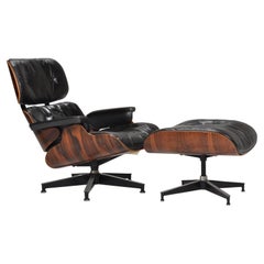 Used Early Eames Chair and Ottoman in Rosewood