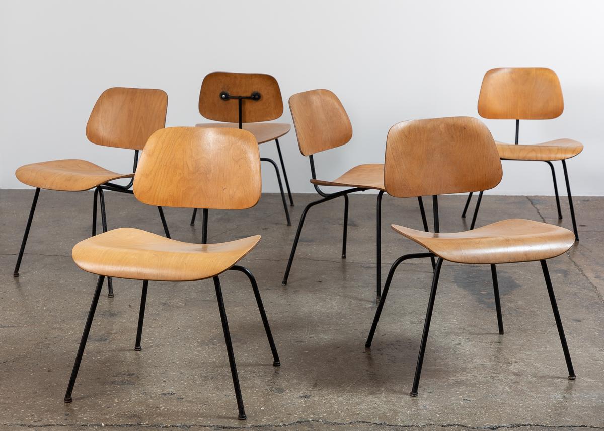 Nice set of early 1950s DCM chairs, designed by Charles and Ray Eames for Herman Miller. These are well-preserved  second generation examples in a fetching birch and black combination, acquired together as a set.  Plywood has wonderful patina from