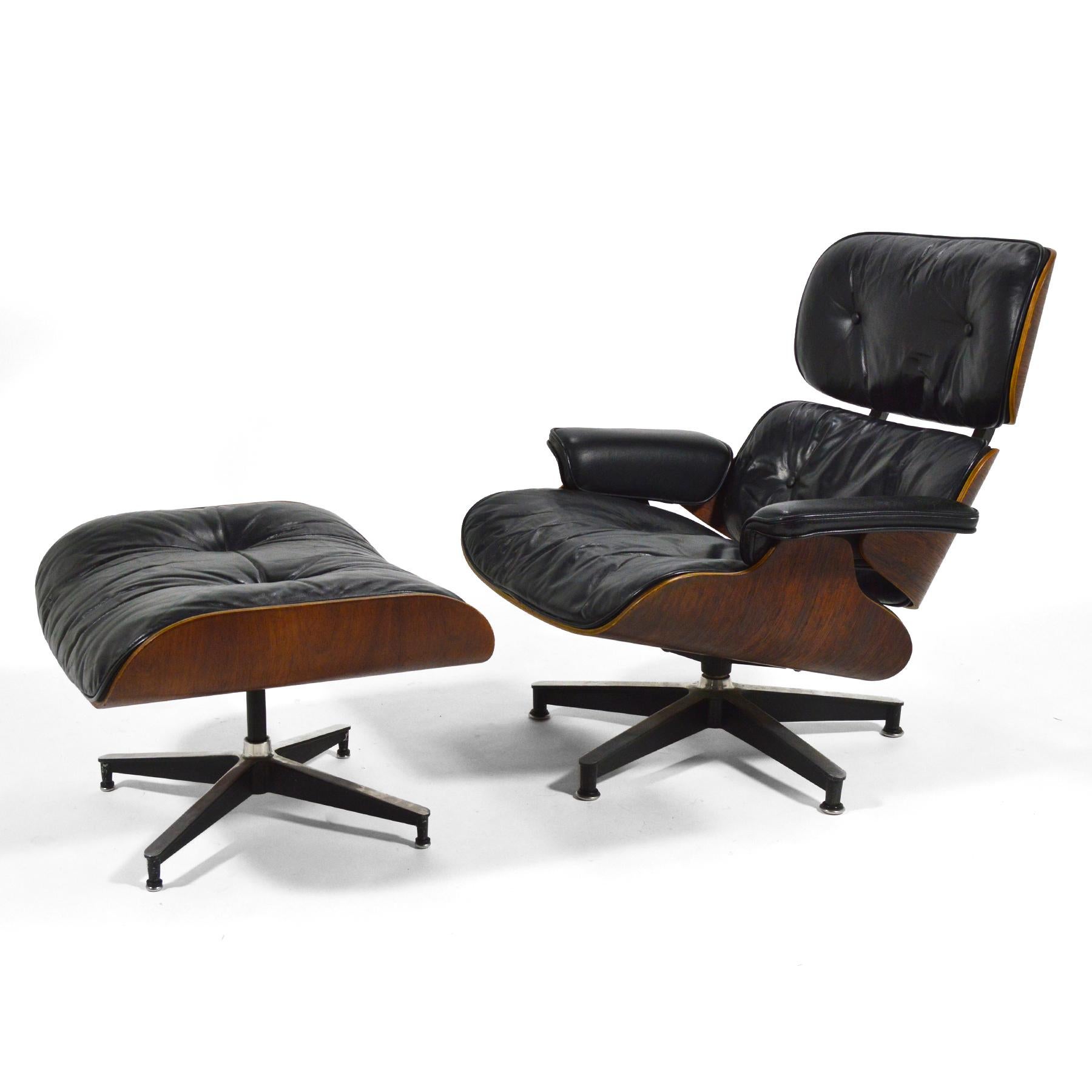 An exceptional early example of the iconic design by Charles and Ray Eames with great provenance, this 670 lounge chair and matching 671 ottoman is entirely original. It features down-filled cushions, rosewood shells, rubber spacers, and has a