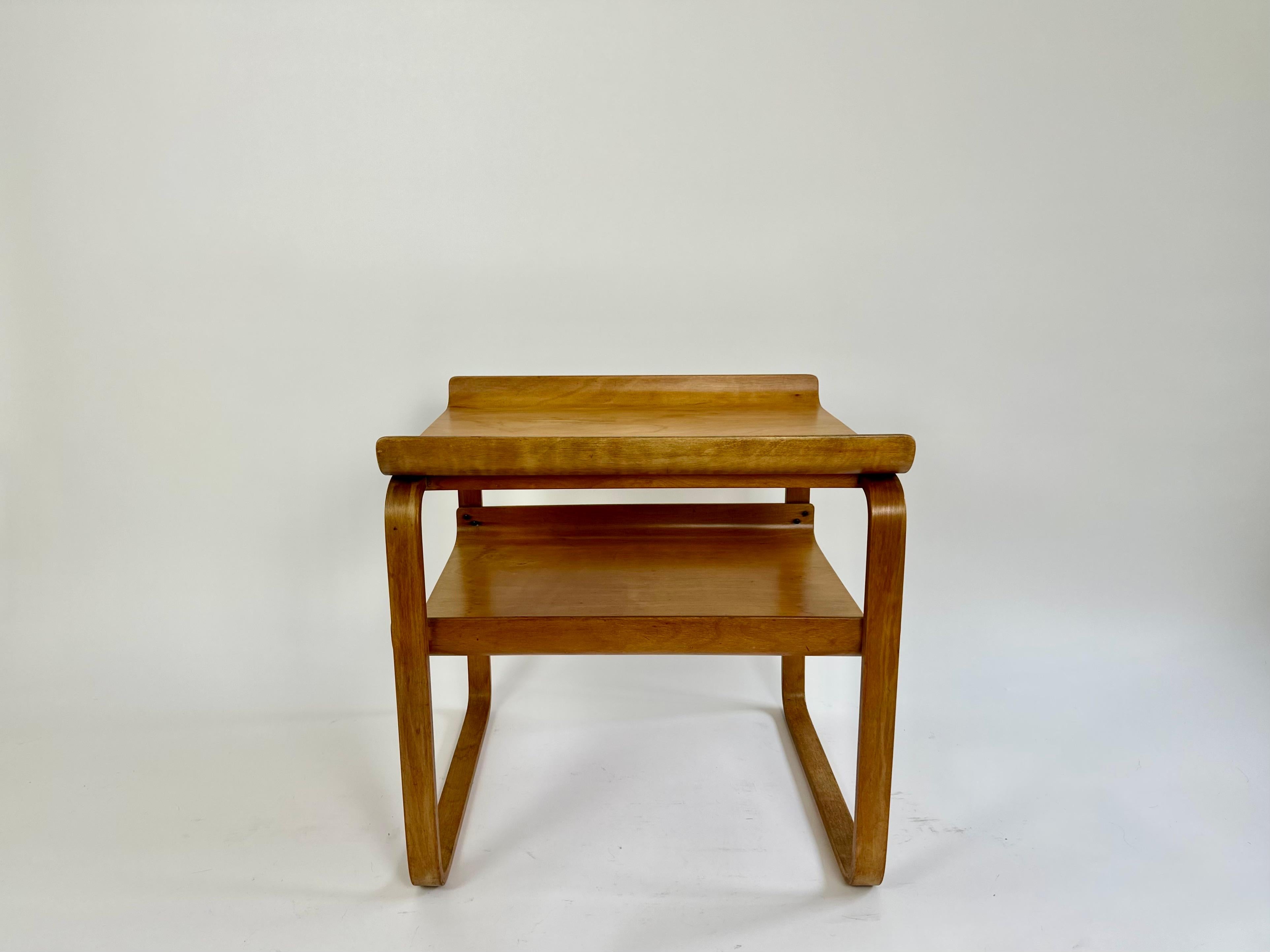 A rare two tier table model 915 designed by Alvar Aalto in 1932 for the Paimio Sanatorium, Finland.

This superb table is an original early edition dating from the 1930s. 

Finmar Ltd ivorine label to the underside.

Provenance: From the estate of a
