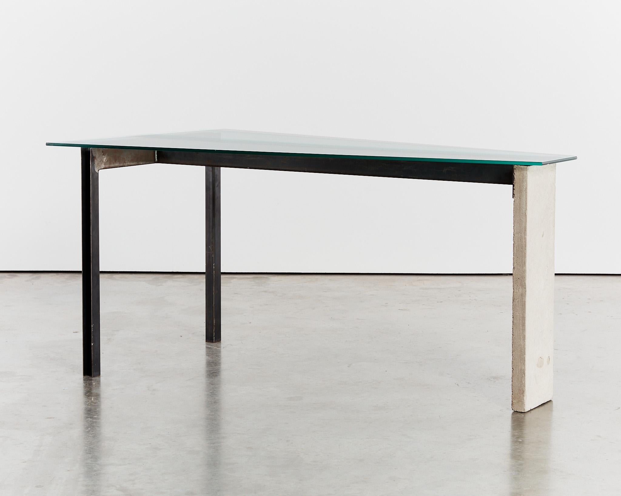 Early edition ‘Concrete’ table designed by Jonas Bohlin for Swedish manufacturer Källemo. With a patinated steel frame and contrasting concrete leg, the angular desk has a reductive design in keeping with Bohlin's earlier work
No more than 100