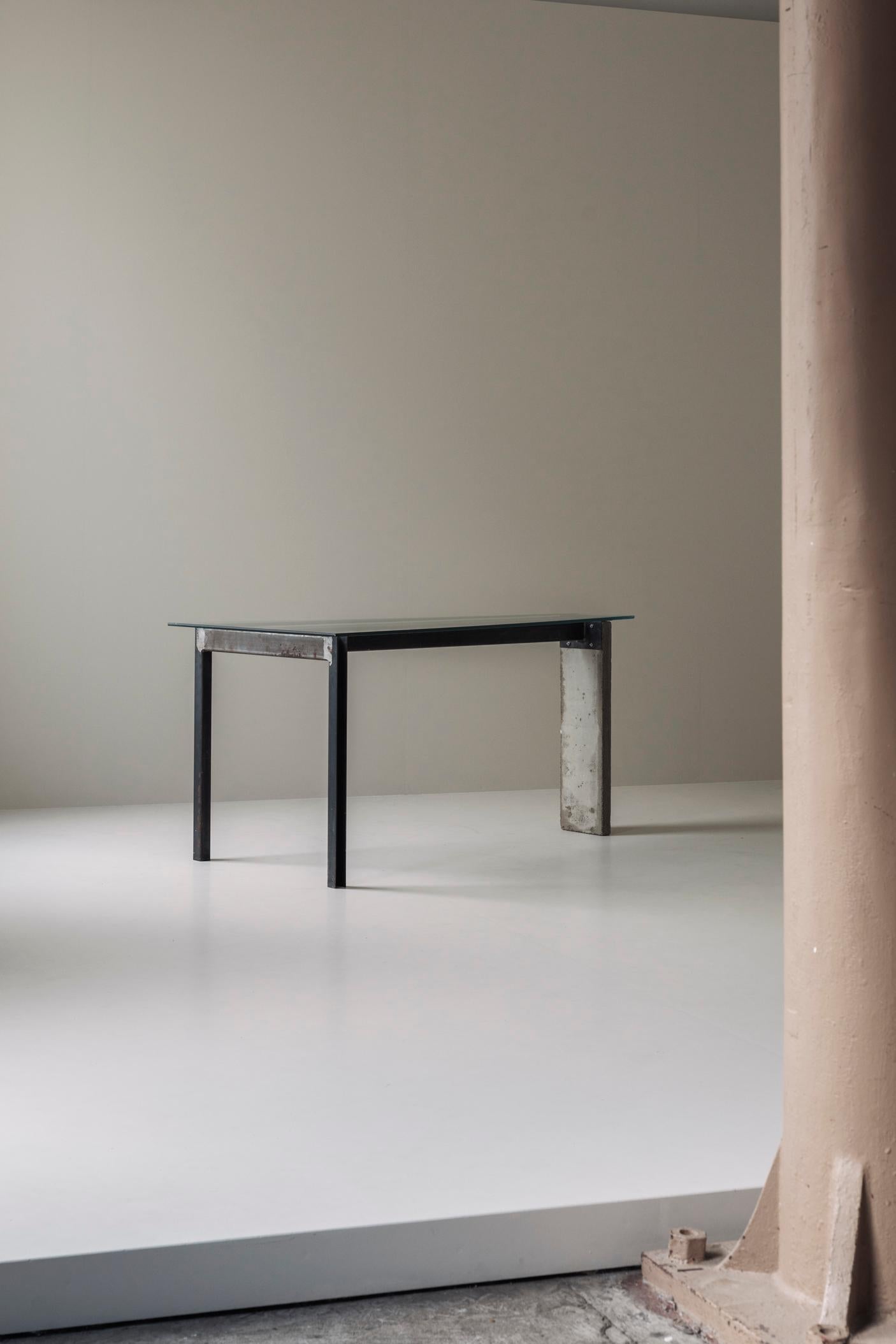 Early edition ‘Concrete’ table designed by Jonas Bohlin for Källemo in Sweden around 1985. This desk or console table is made of lacquered steel, concrete and glass. The form is reduced to its bare essentials, characteristic of Bohlin’s early work.