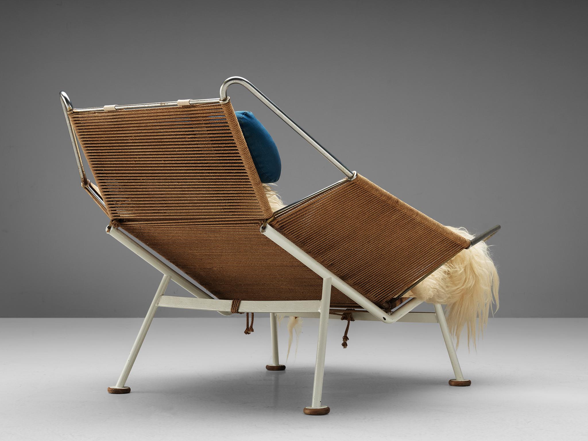 Hans Wegner, Flag Halyard chair GE225, rope, white lacquered steel, Denmark, 1950.

This iconic chair, made with 250 meter of rope, is designed by Hans Wegner. The name Flag Halyard simply comes from the innovative material with which Wegner makes