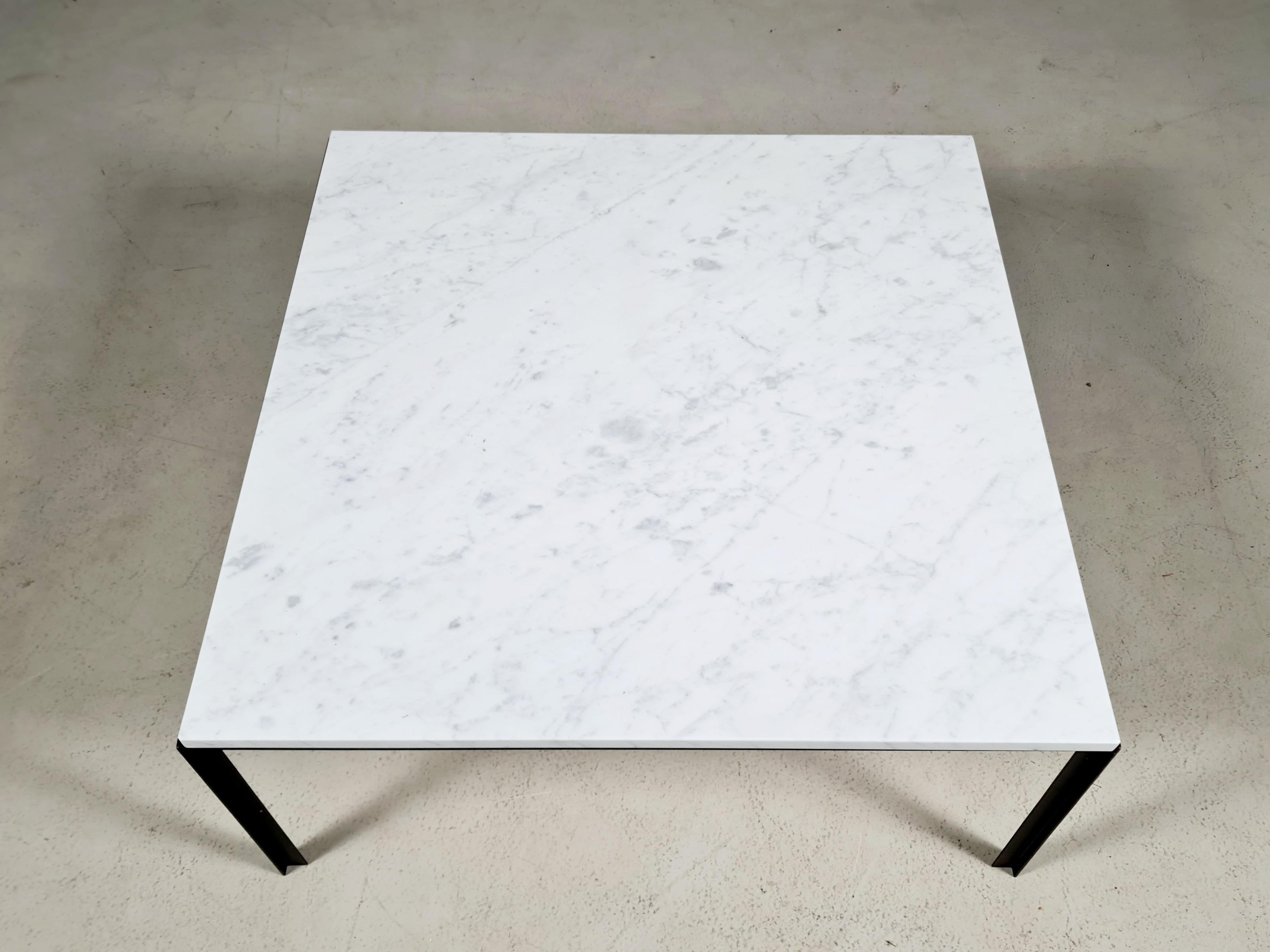 Square T Angle coffee table in marble and black lacquered metal by Florence Knoll. Made by (license holder for Knoll) De Coene Belgium in the 1950s. The feet are T-shaped, giving the table its name.