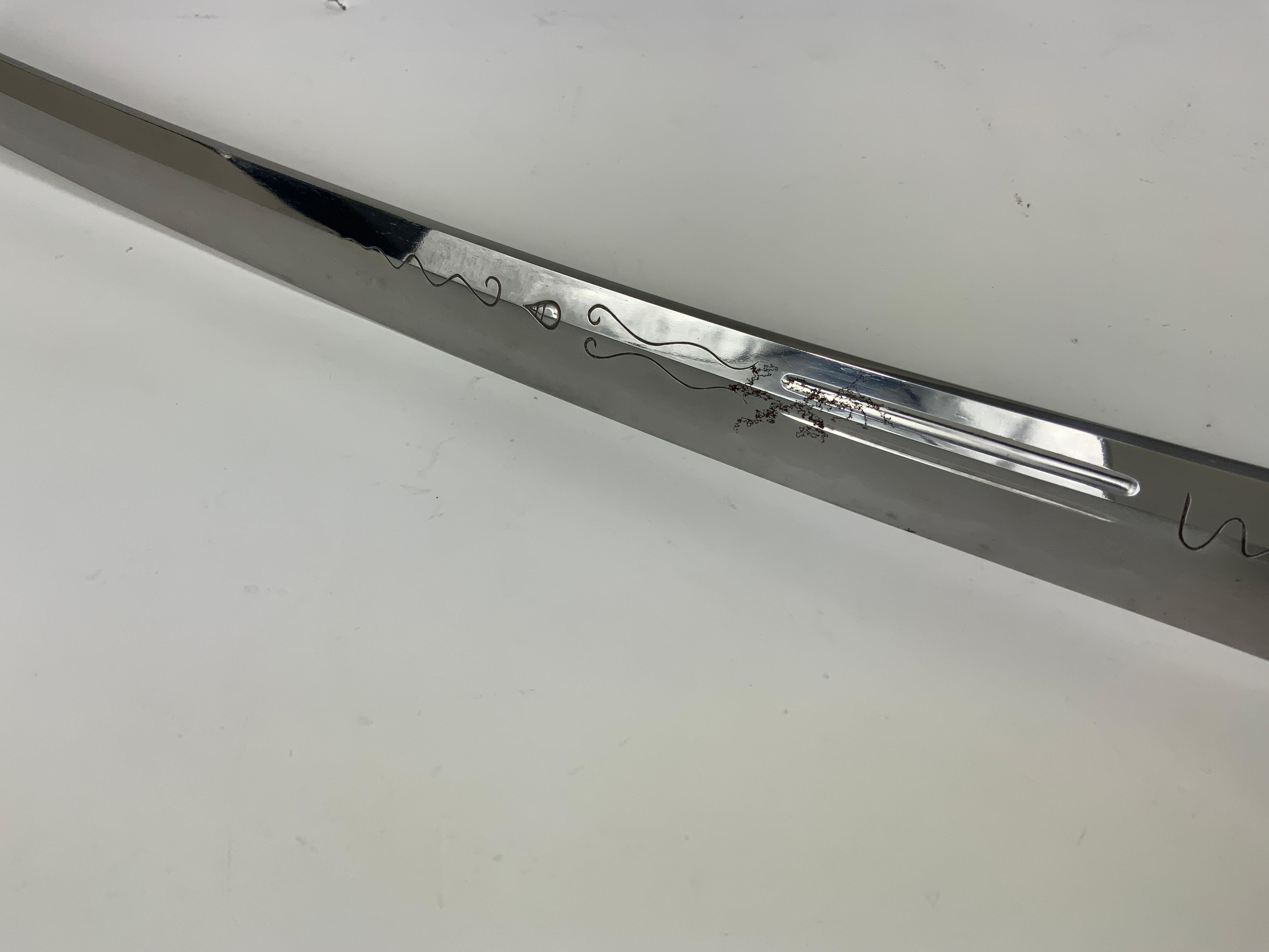 Japanese Wakizashi sword forged and signed by Kanefusa, a blacksmith from one of the great lineages of blacksmiths in the Mino region of Japan. 
The Edo period started in 1603 and ran until 1868. 

The authentication document or “origami” was issued