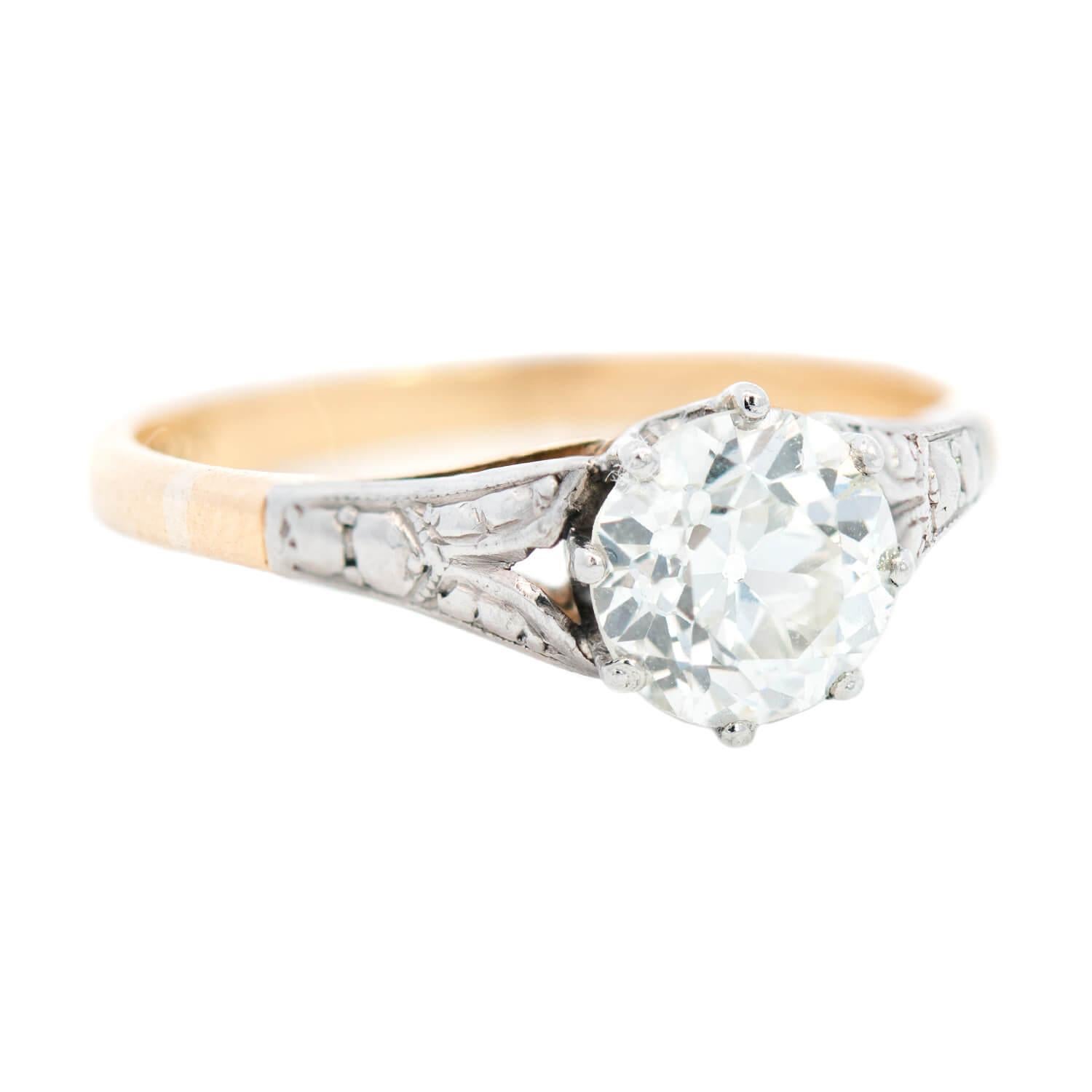 A lovely diamond ring from the Edwardian (ca1900) era! Beautiful in its simplicity, this solitaire-style ring has a mixed metals design crafted in 14k gold and platinum. At the center is a single diamond, which rests in a white gold 8-prong setting.