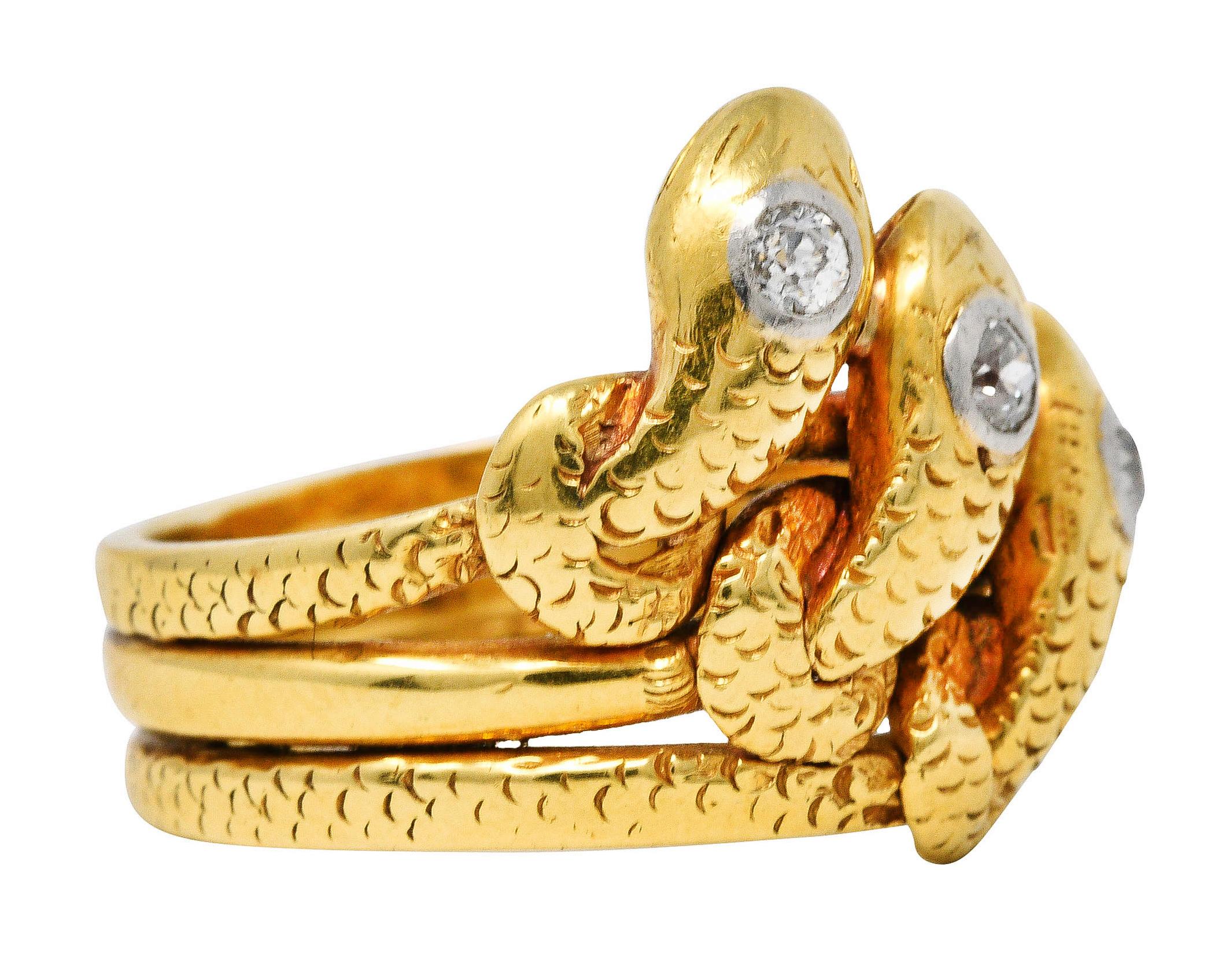 Ring is designed as three snakes as a triple band with knotted motifs

Each snake is textured by stylized scales and features an old European cut diamond

Bezel set in platinum while weighing in total approximately 0.40 carat - J/K color and SI