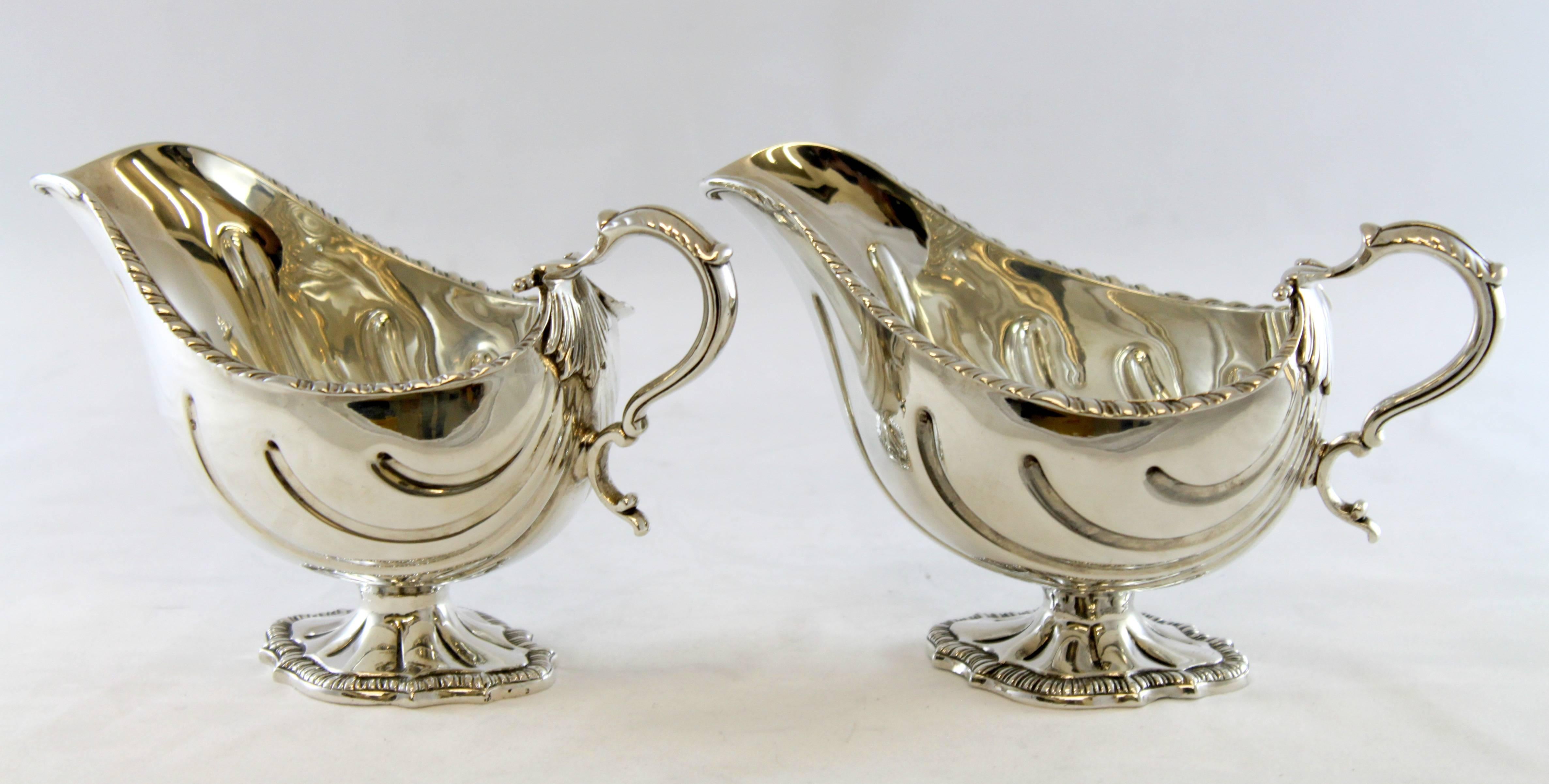 Antique pair of sterling silver cream jars 
Maker: Carrington & Co 
Made in London, 1900.
Fully hallmarked. 

Dimensions: 
Size: 19.5 x 10.1 x 12 cm 
Weight: 765 grams total.

Condition: Surface wear and tear from general usage, has a