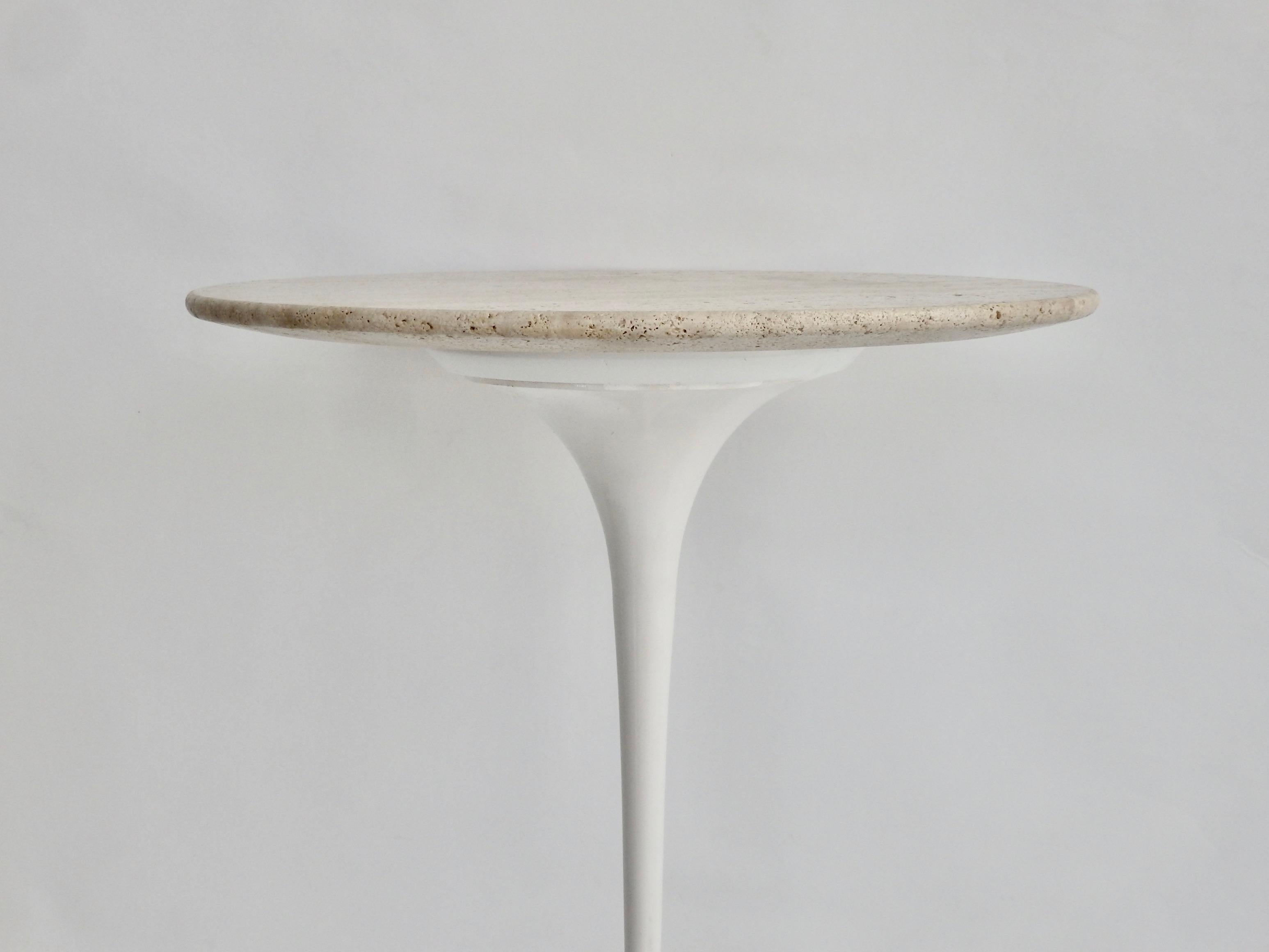 Eero Saarinen for Knoll Tulip table. Early one-piece cast iron base evens center of gravity keeping the table well balanced. Top is open grained travertine.