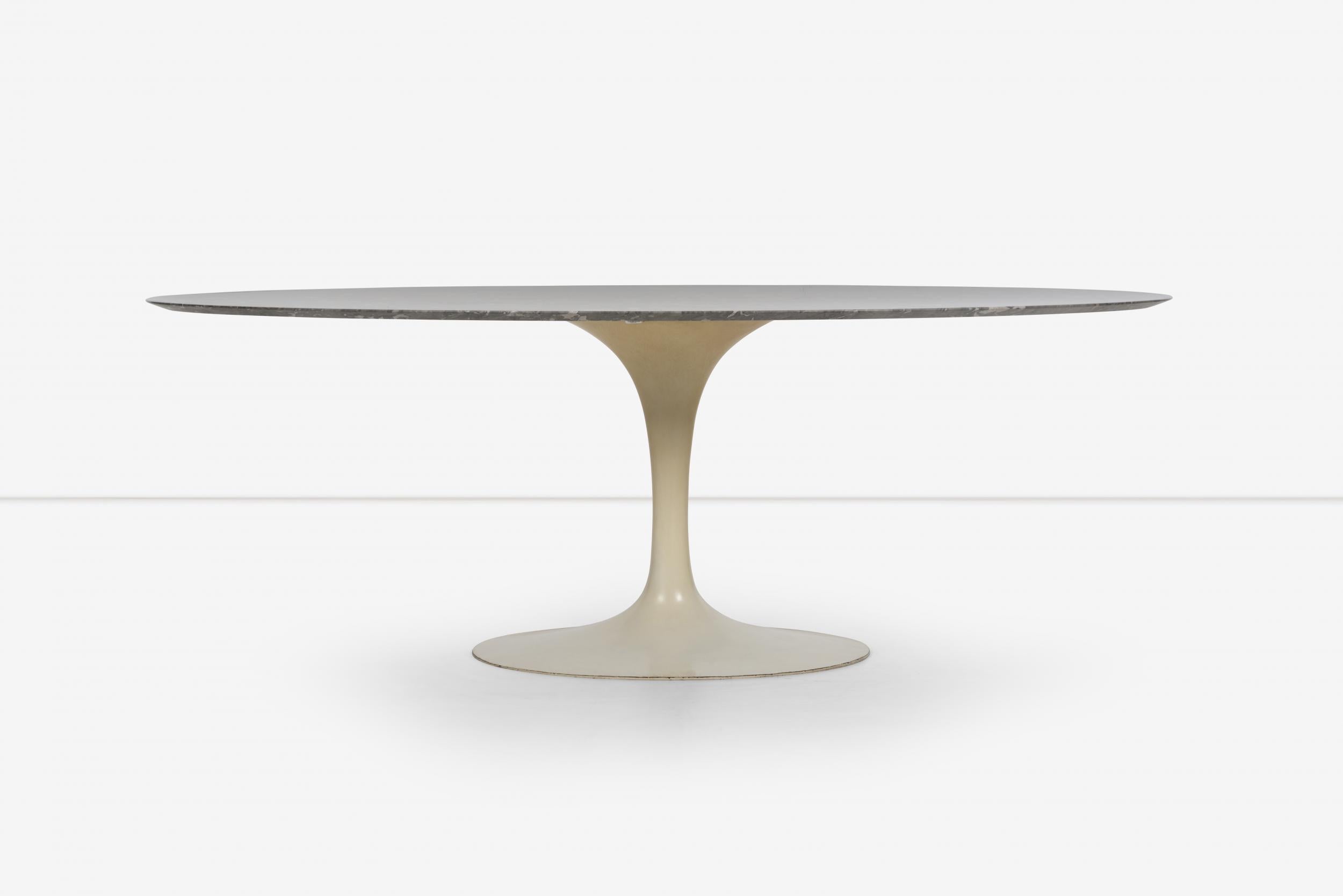 Early Eero Saarinen for Knoll Tulip table cast iron base, marble top dark grey marble with whit veins. 
Base retains Knoll International label underside.