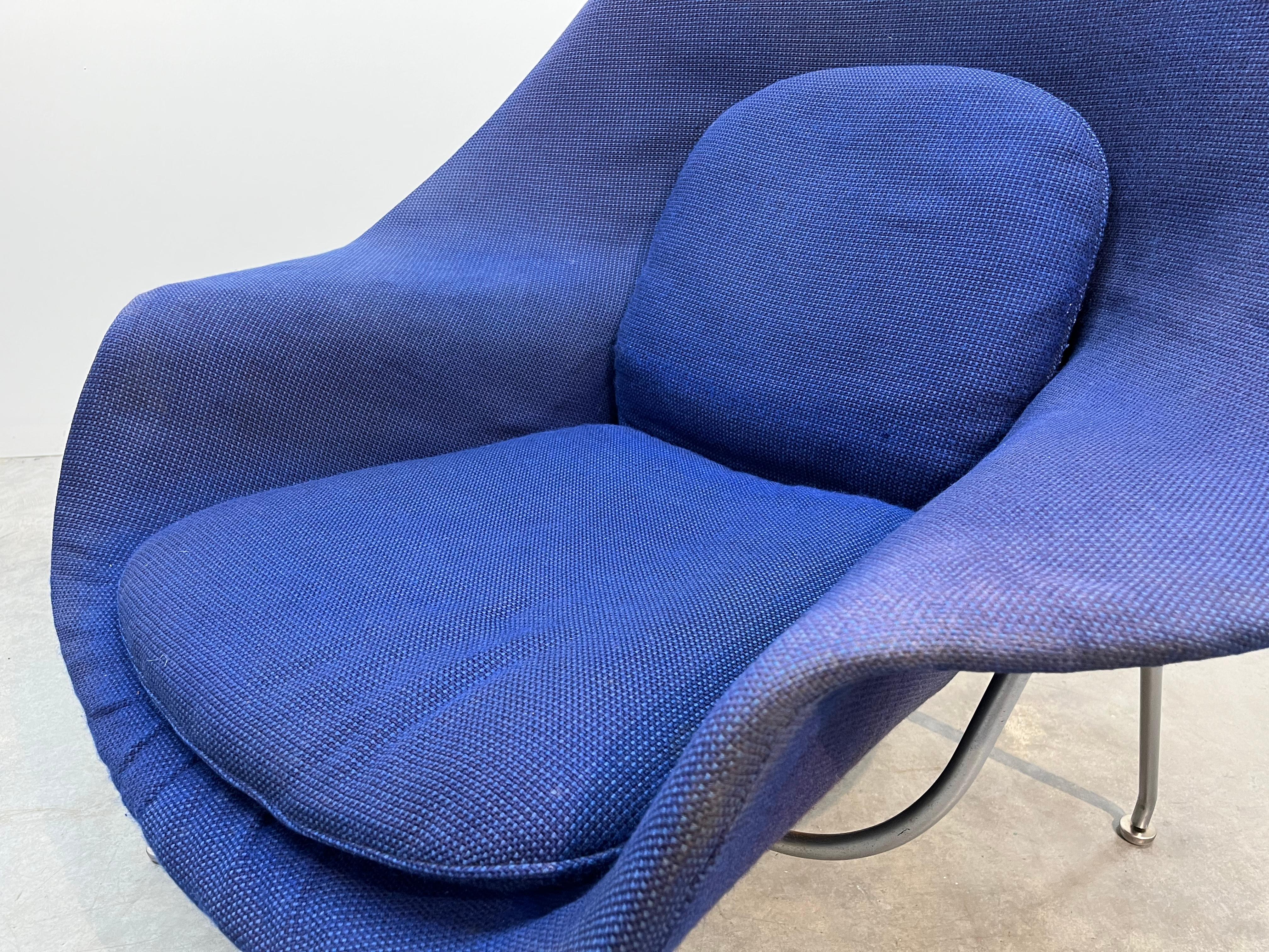 Eero Saarinen for Knoll Womb chair and ottoman circa 1960 as having rare original Knoll Cornflower Blue tweed upholstery. 
 In beautiful original condition having wonderful patina being gently used and cared for by its original owner. Original