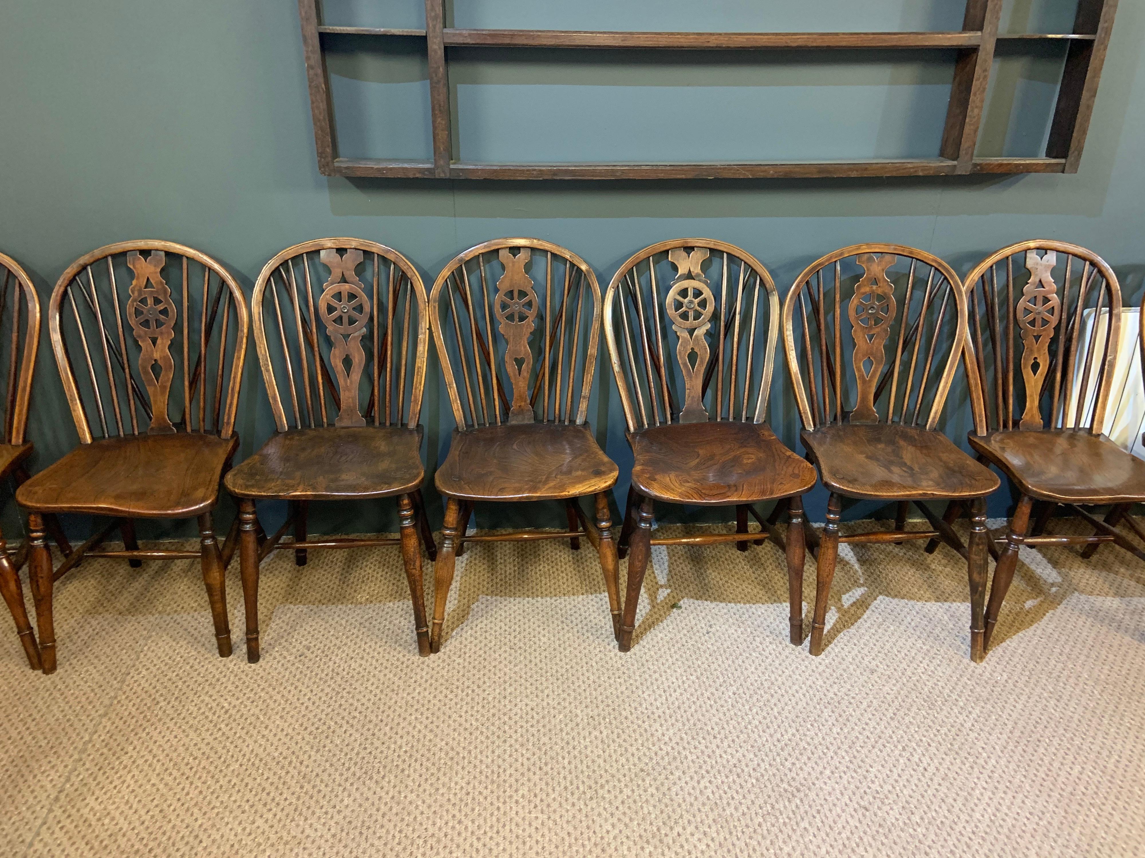 Early 19th century Windsor wheel back chairs in excellent condition and wonderful color and patination. Lovely large seats and all very comfortable.