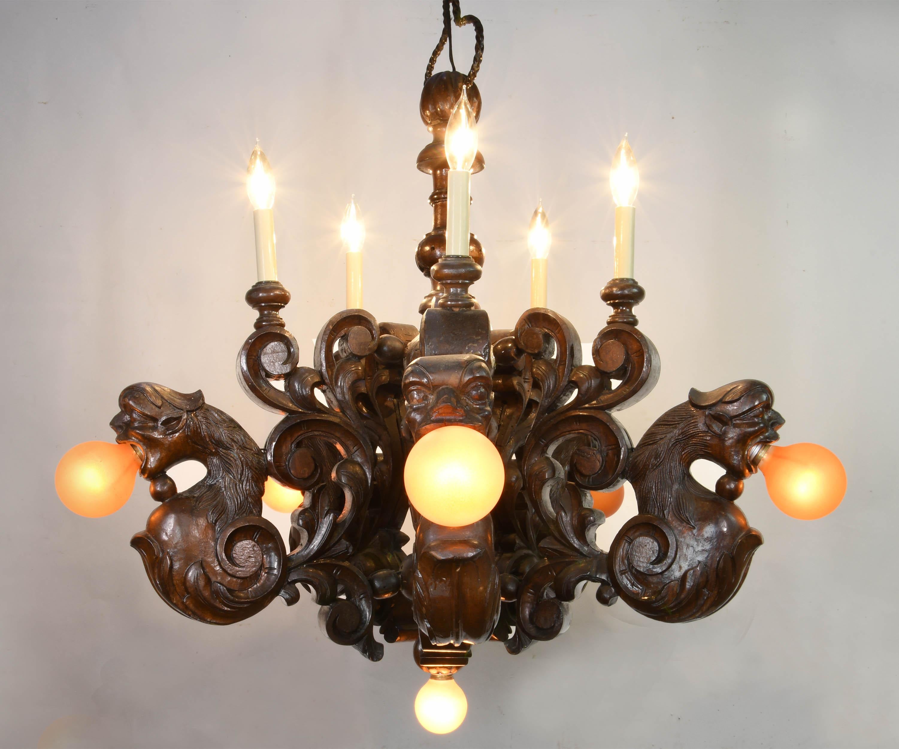 This grand Gothic design of 11 lights and five dragon heads will bring harmony to any large Tudor room. Central orbs create the central body of the fixture with beaded elements holding substantial carved acanthus which meta-morph into bearded