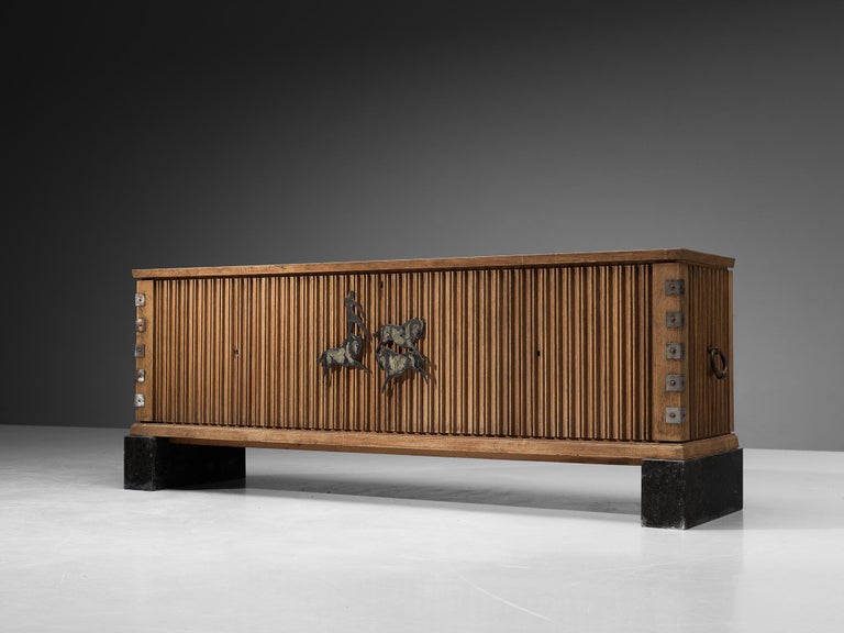 Emiel Veranneman, sideboard, oak, metal, enamel, Belgium, 1950s

A very rare early piece by the Belgian designer and artist Emiel Veranneman. This robust sideboard in oak has stunning detailing and is a very high quality piece. The doors have a