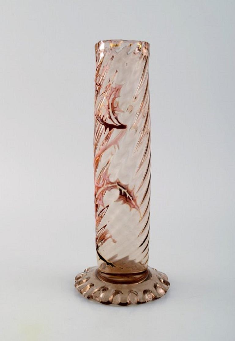 Early Emile Gallé vase in clear frosted art glass with thistle pattern.
Carved with motifs in the form of flowers and leaves.
Wavy bottom and top. Enamel work and gilt. 
Museum quality. Ca. 1885.
Measures: 20.5 x 8.5 cm.
Signed: Gallé.
In