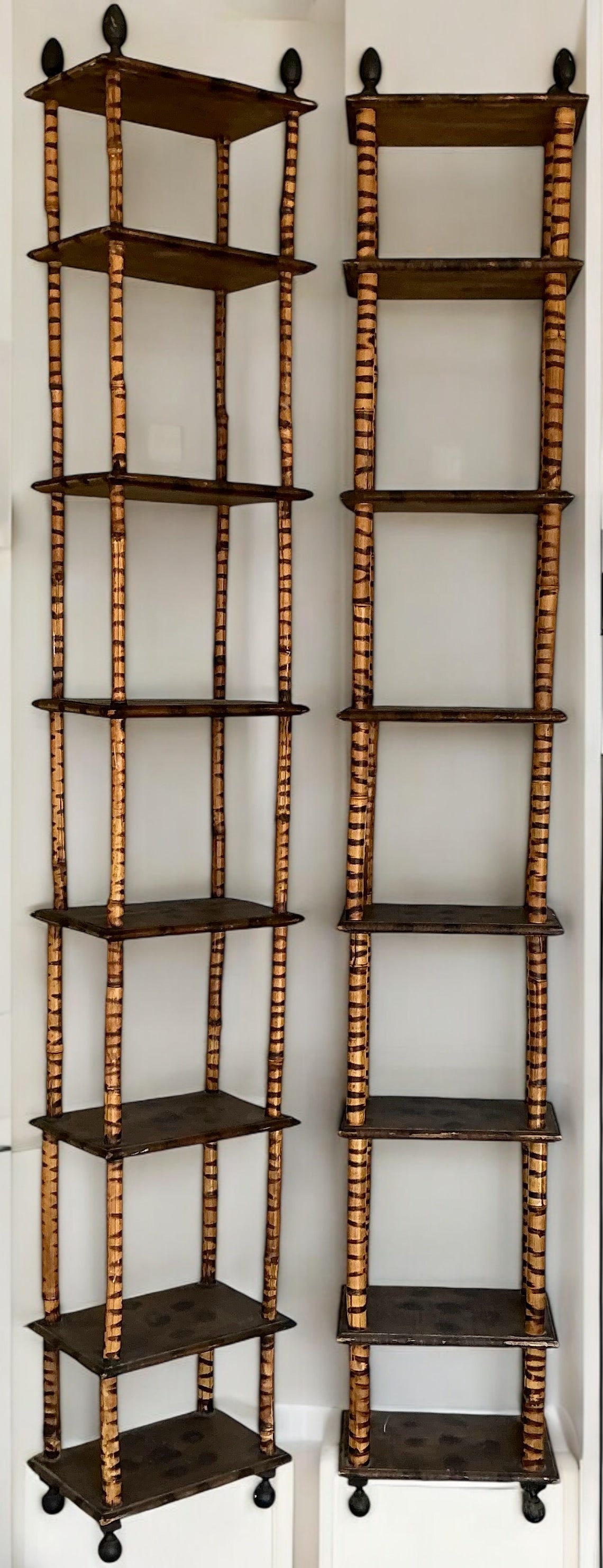 These are really interesting! They are very tall early bamboo etageres with an almost folk art feel to them. They are free standing but think they might be striking as wall mounts too. They are in very good condition, and I believe them to be