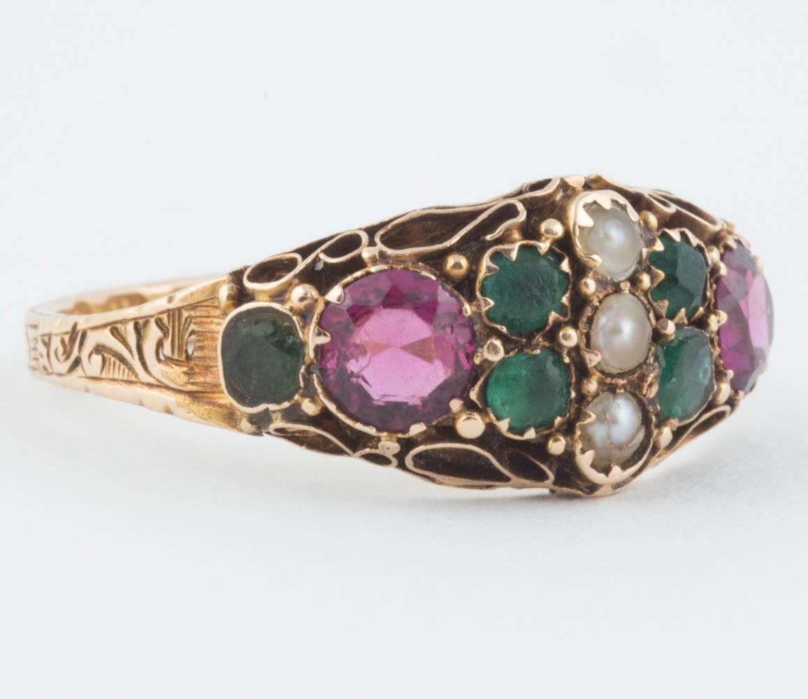 This historic ring from Birmingham England is set with emeralds, garnets and seed pearls, symbolizing the colors of the famous women’s movement (green-hope; purple ambition & loyalty; white-honor) in an intricate gold setting, the shank engraved
