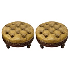 Early English Tufted Gold Leather Chesterfield Ottomans, a Pair