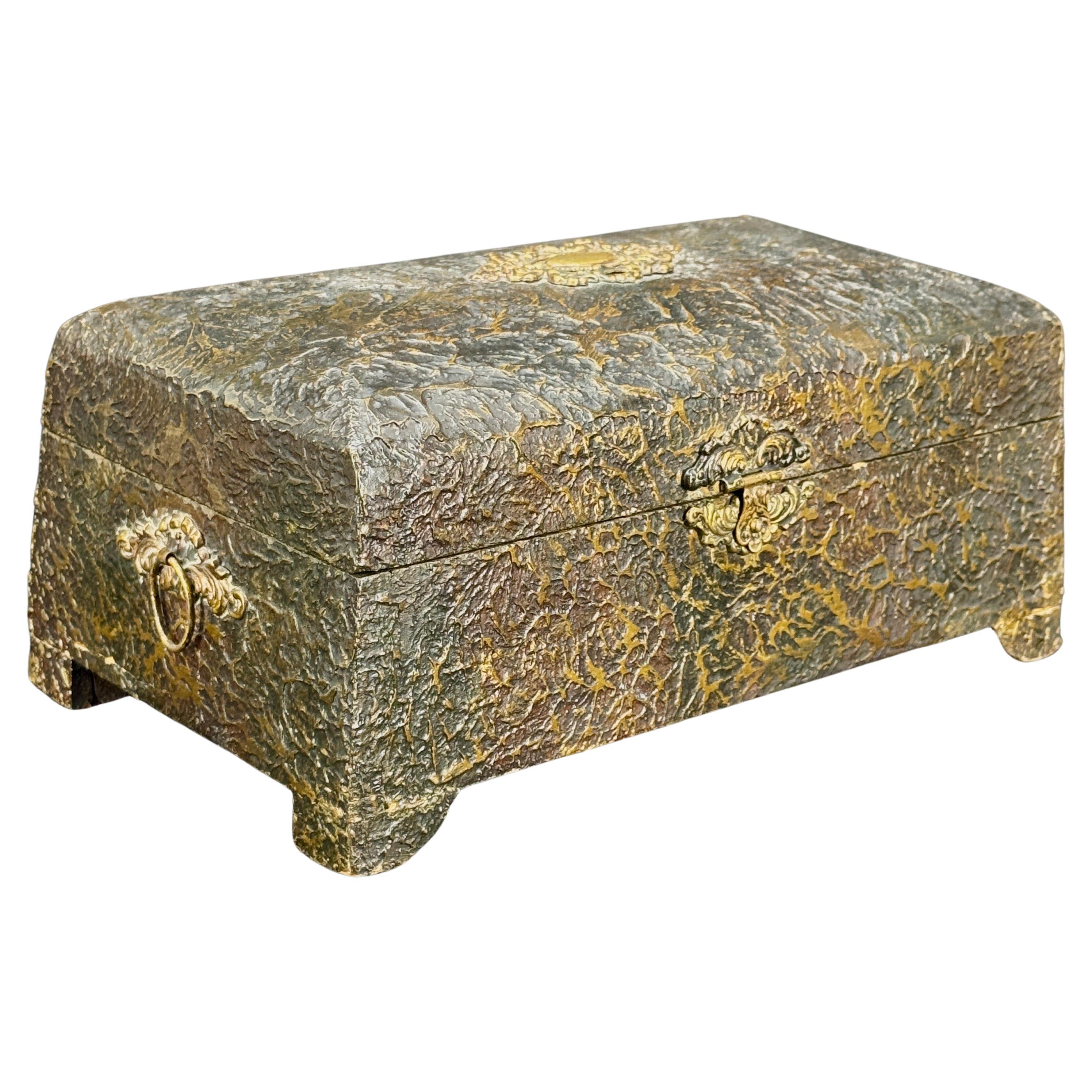 European 19h Century jewelry box with a  green patterned fabric insert. This wood box is handcrafted in a faux bois style with brass hardware and etched mirror glass inside. The condition of the box is really sturdy, the lid closes nicely and has in