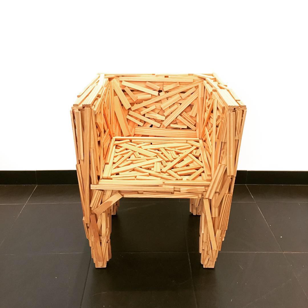 Early Favela armchair designed by Fernando and Humberto Campana for Edra, Italy, 2003. Sculptural chair without internal structure, built with pieces of natural Brazilian Pinus wood, fixed by hand in a deliberately random.