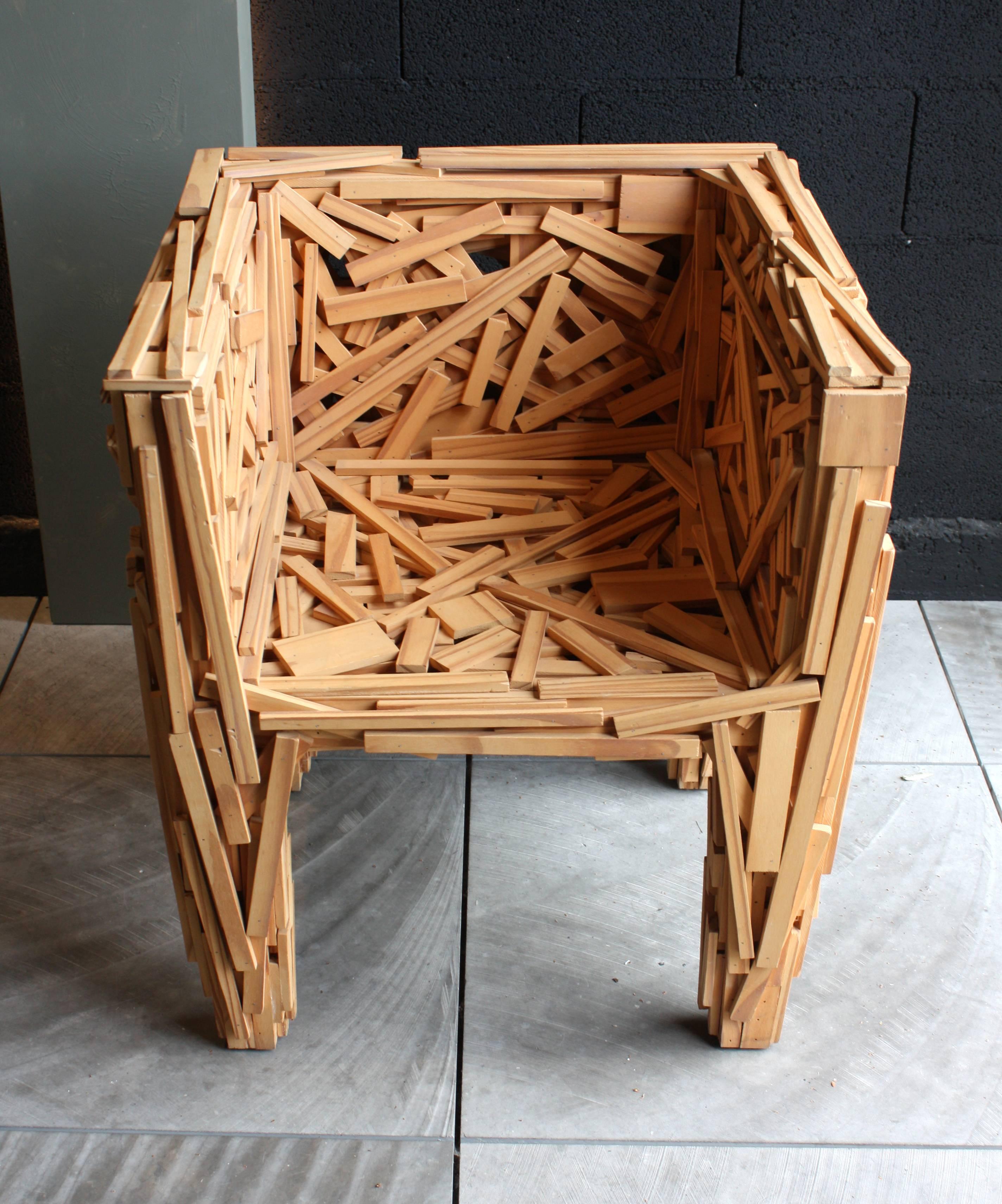 Early Favela armchair designed by Fernando and Humberto Campana for Edra, Italy, 2003. Sculptural chair without internal structure, built with pieces of natural Brazilian Pinus wood, fixed by hand in a deliberately random. Indoor and outdoor use.
