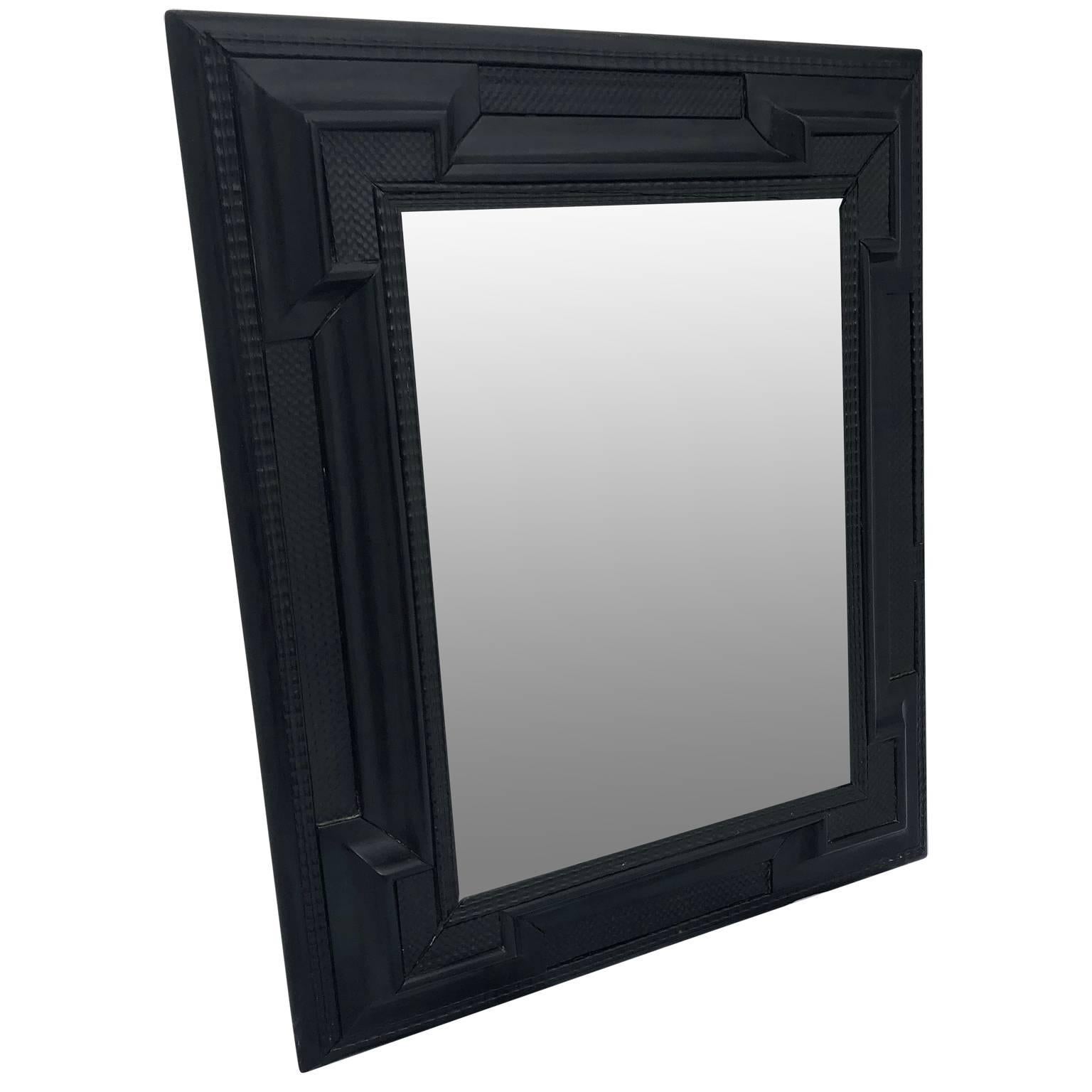Early Flemish Or Scandinavian ebonized Baroque style wall mirror with bevelled mirror glass