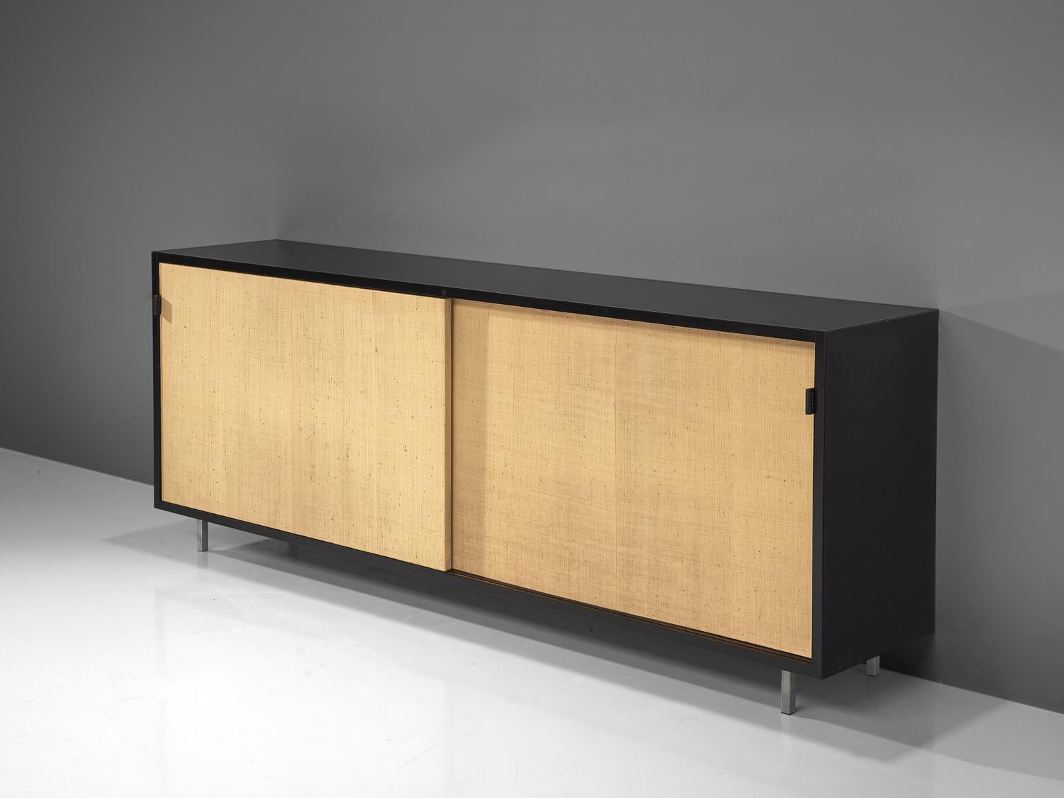 Florence Knoll for Knoll, cane, ebonized wood, metal, cane, United States, 1961.

This sideboard is designed by Florence Knoll for Knoll International and was meant for the headquarters of Knoll in Italy. The credenza is executed with two large