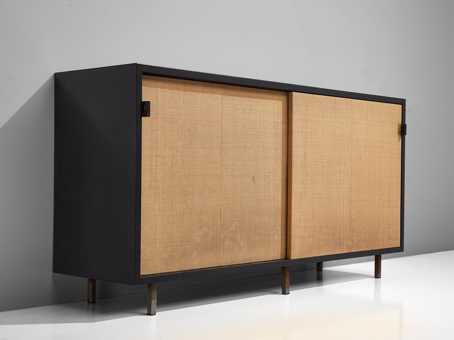 Florence Knoll for Knoll, sideboard, cane, ebonized wood, and metal, United States, 1961.

This sideboard is designed by Florence Knoll for Knoll International and was meant for the headquarters of Knoll in Italy. The credenza is executed with two