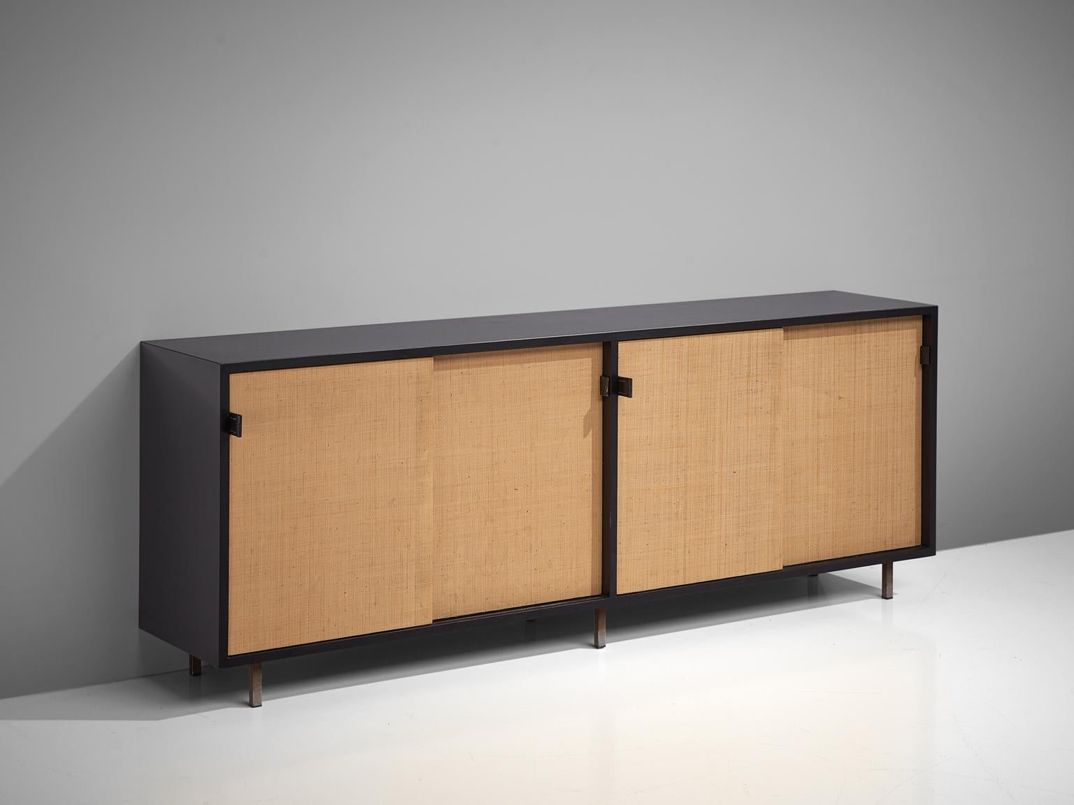 Florence Knoll for Knoll, sideboard, cane, ebonized wood and metal, United States, 1961.

This sideboard is designed by Florence Knoll for Knoll International and was meant for the headquarters of Knoll in Italy. The credenza is executed in two